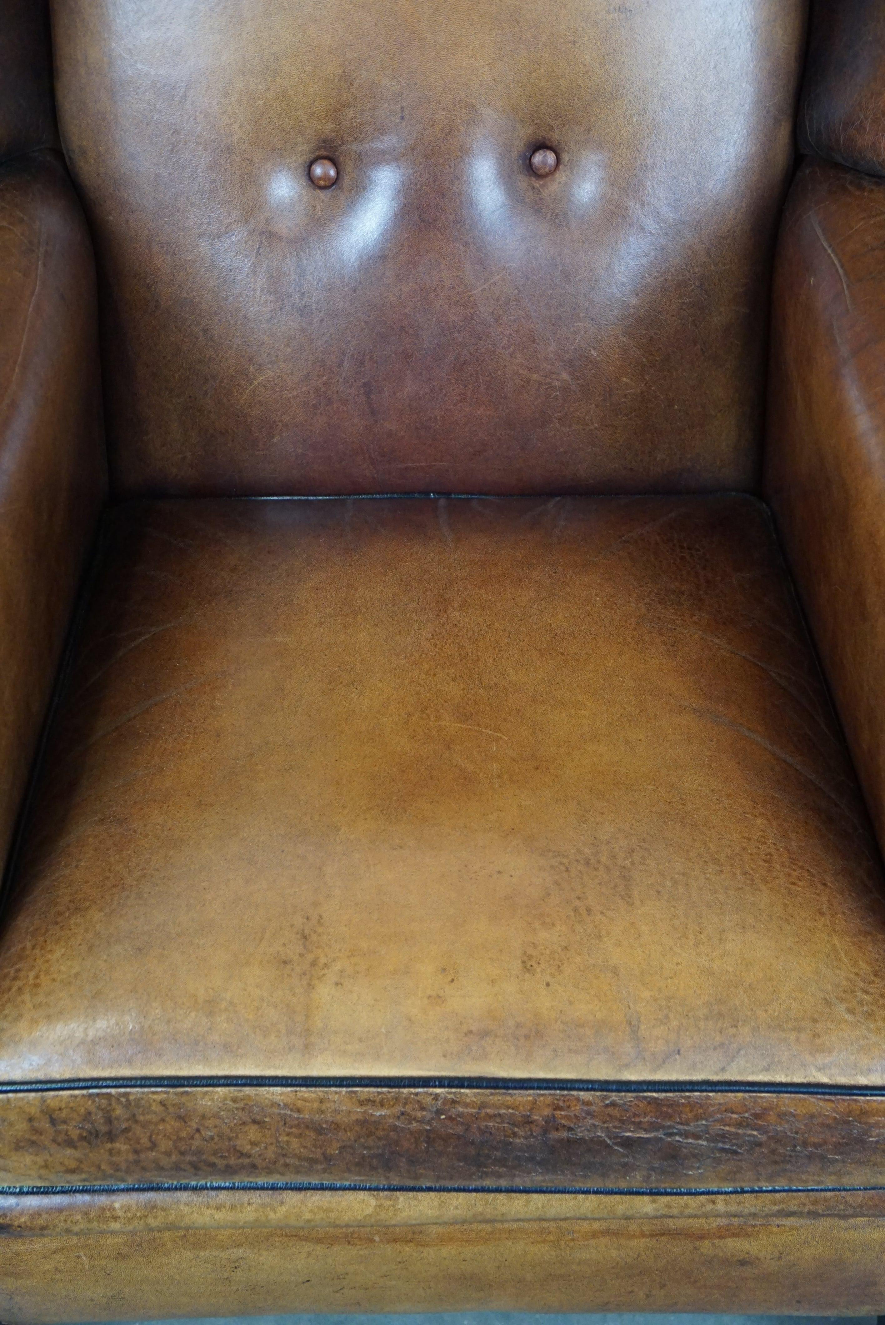 Leather Large and very comfortable wingback armchair made of sheep leather For Sale