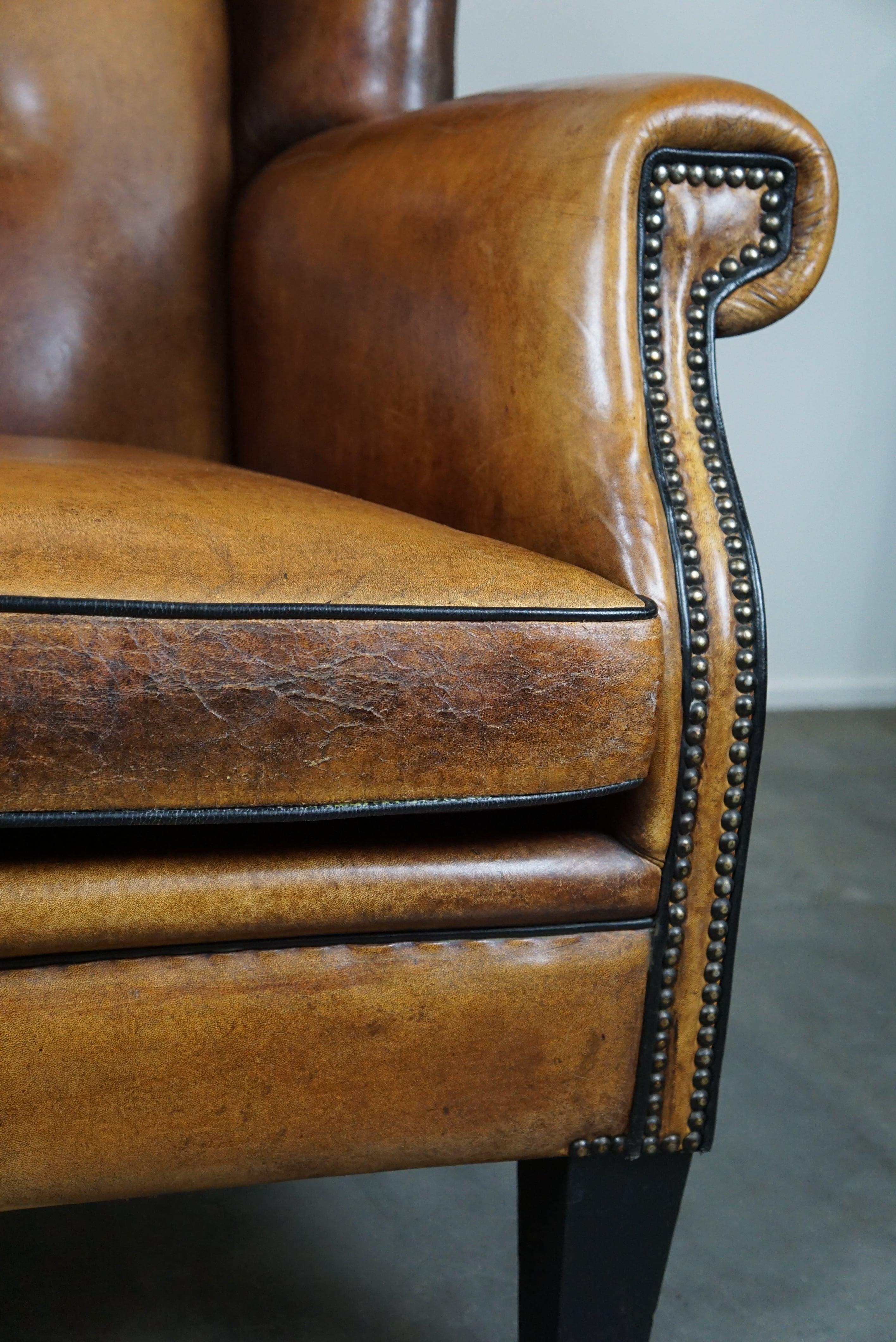 Large and very comfortable wingback armchair made of sheep leather For Sale 3