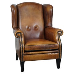 Vintage Large and very comfortable wingback armchair made of sheep leather