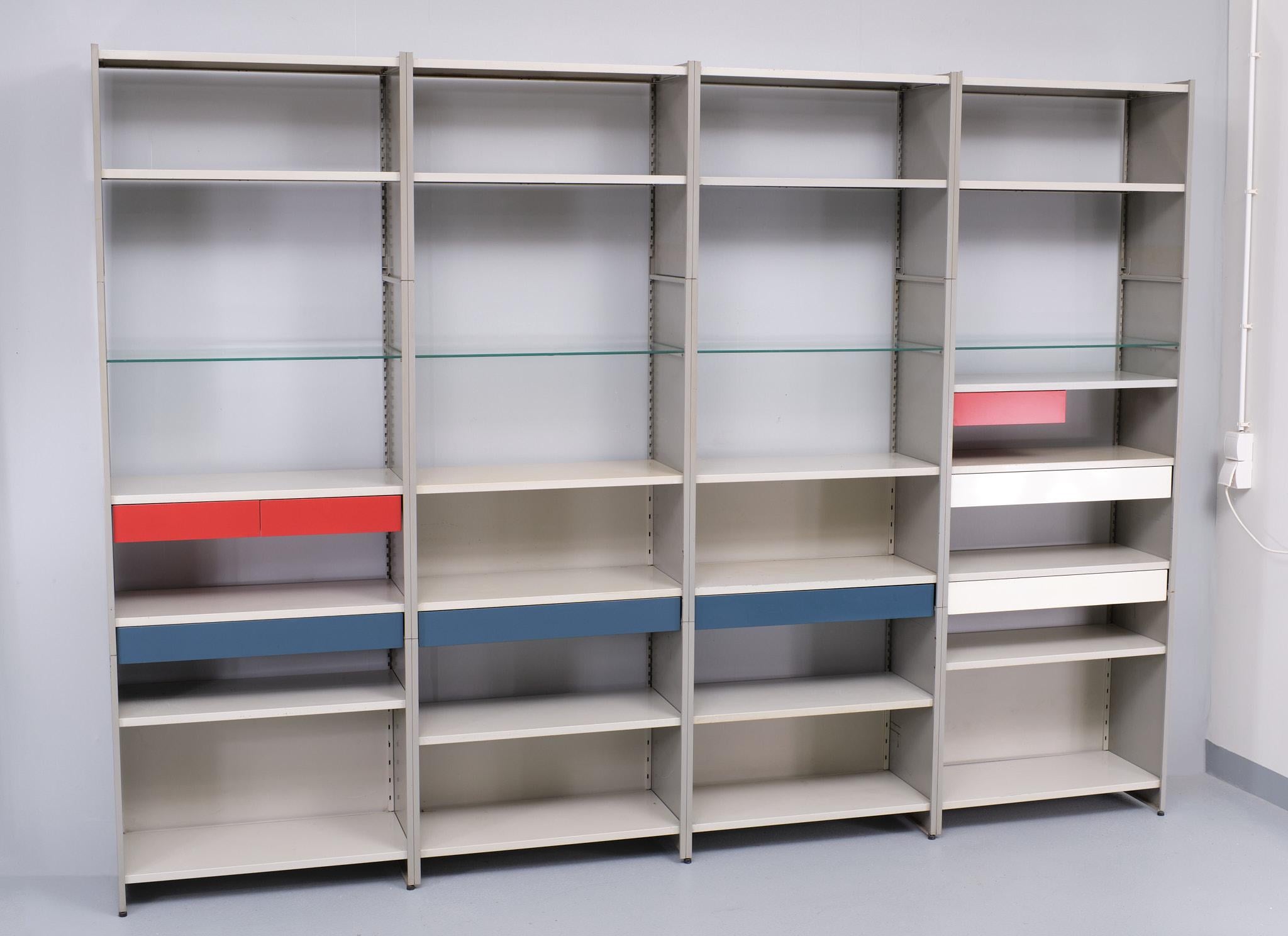 Large Metal modular wall system .design by Andre Cordemeyer for Gispen 
1960 . Holland .''model 5600 '' Mondriaan in style and colors . great designed wall system.
8 drawers in Mondriaan colors 25 shelves 4 Glass . lots of storage space .
