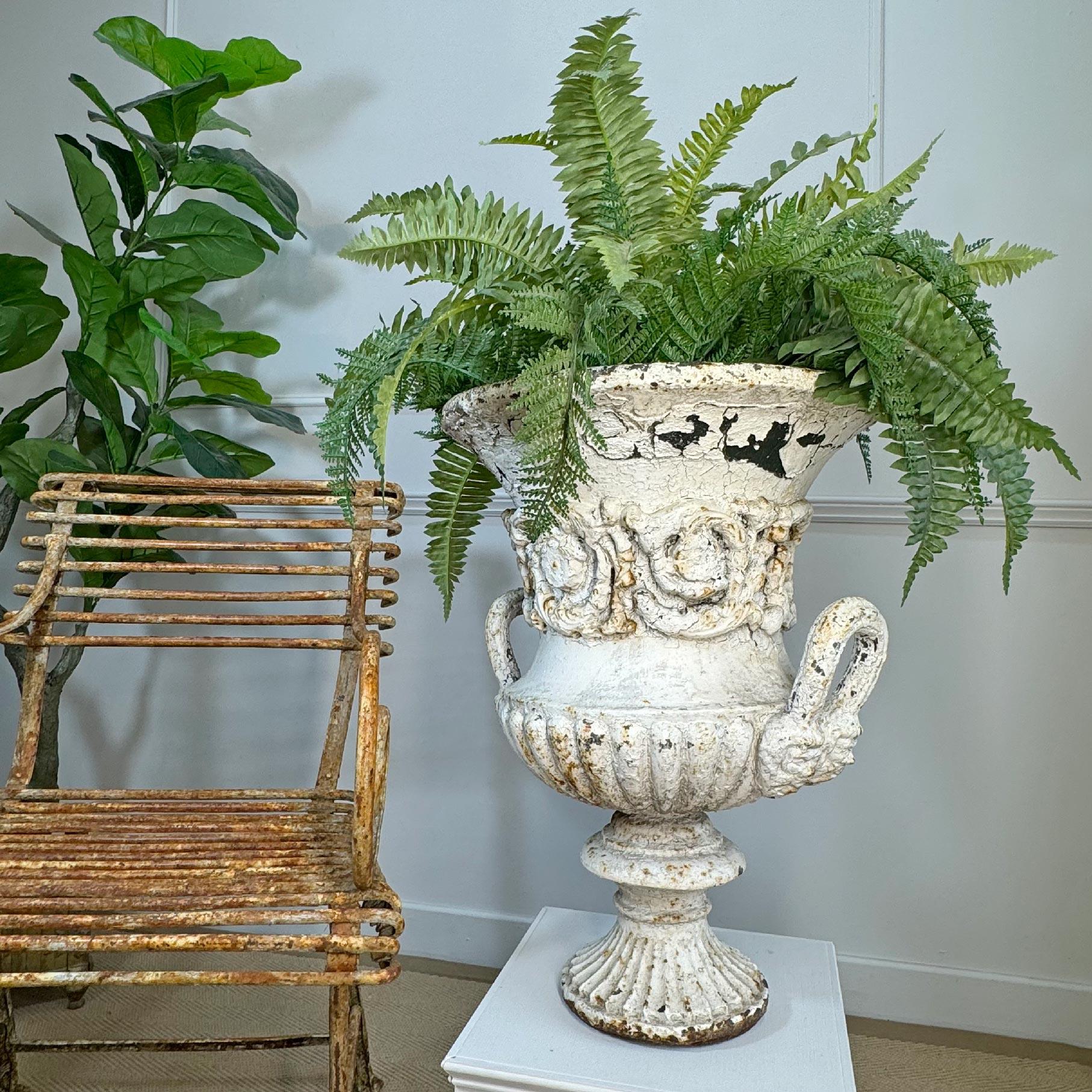 A substantial 19th century cast iron urn by the Handyside company of Deby, circa 1870, time worn patina, a century of paint and some very minor lost areas of the outer decorative swag.



A stunning interior or exterior urn of the highest quality,