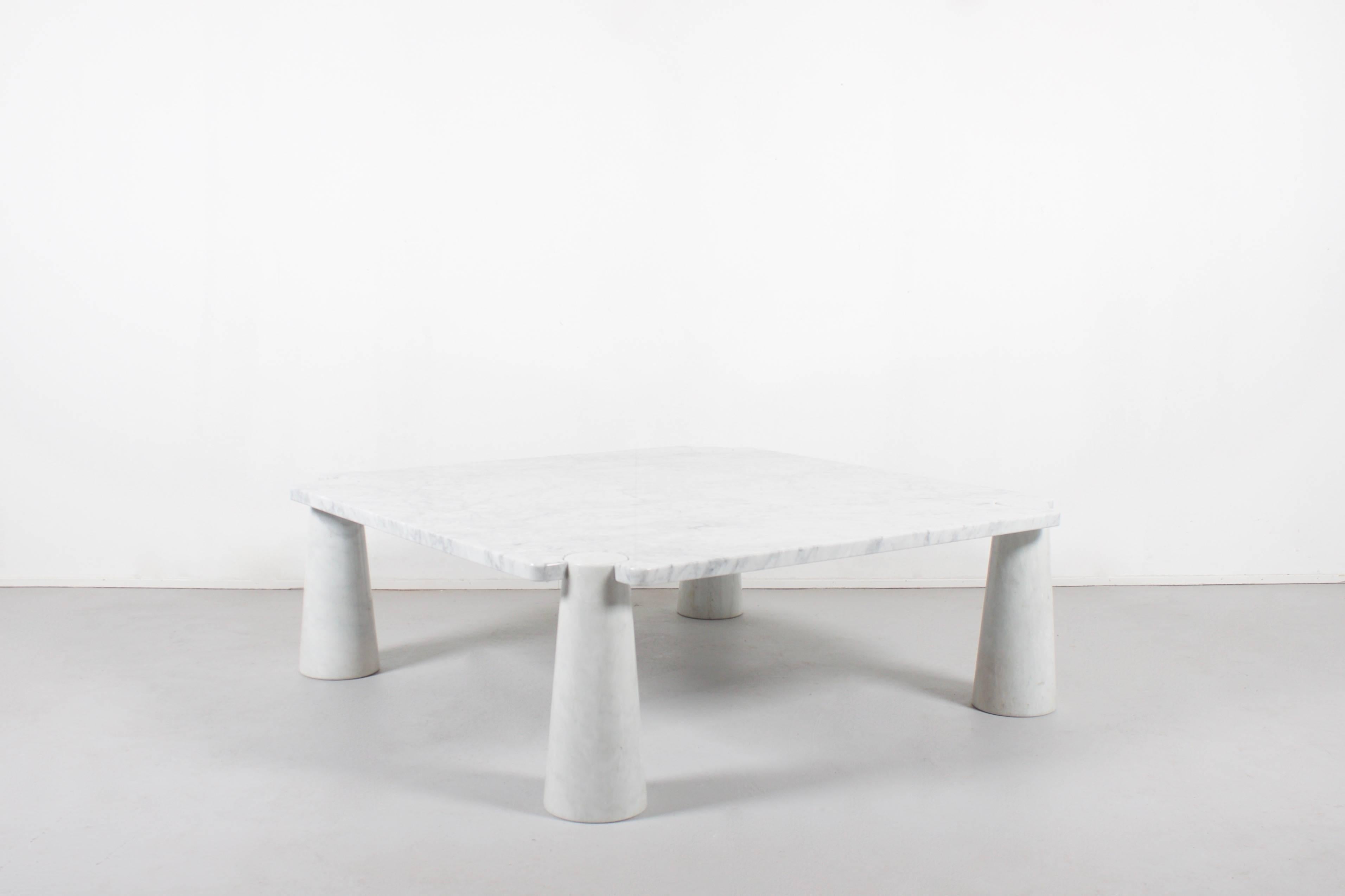 Fantastic ‘Eros’ coffee table in excellent condition. 

This particular table consists of a white Carrara marble top and conical bases. 

The structural design of the Eros tables incorporate a gravity-based embedding between the table top and