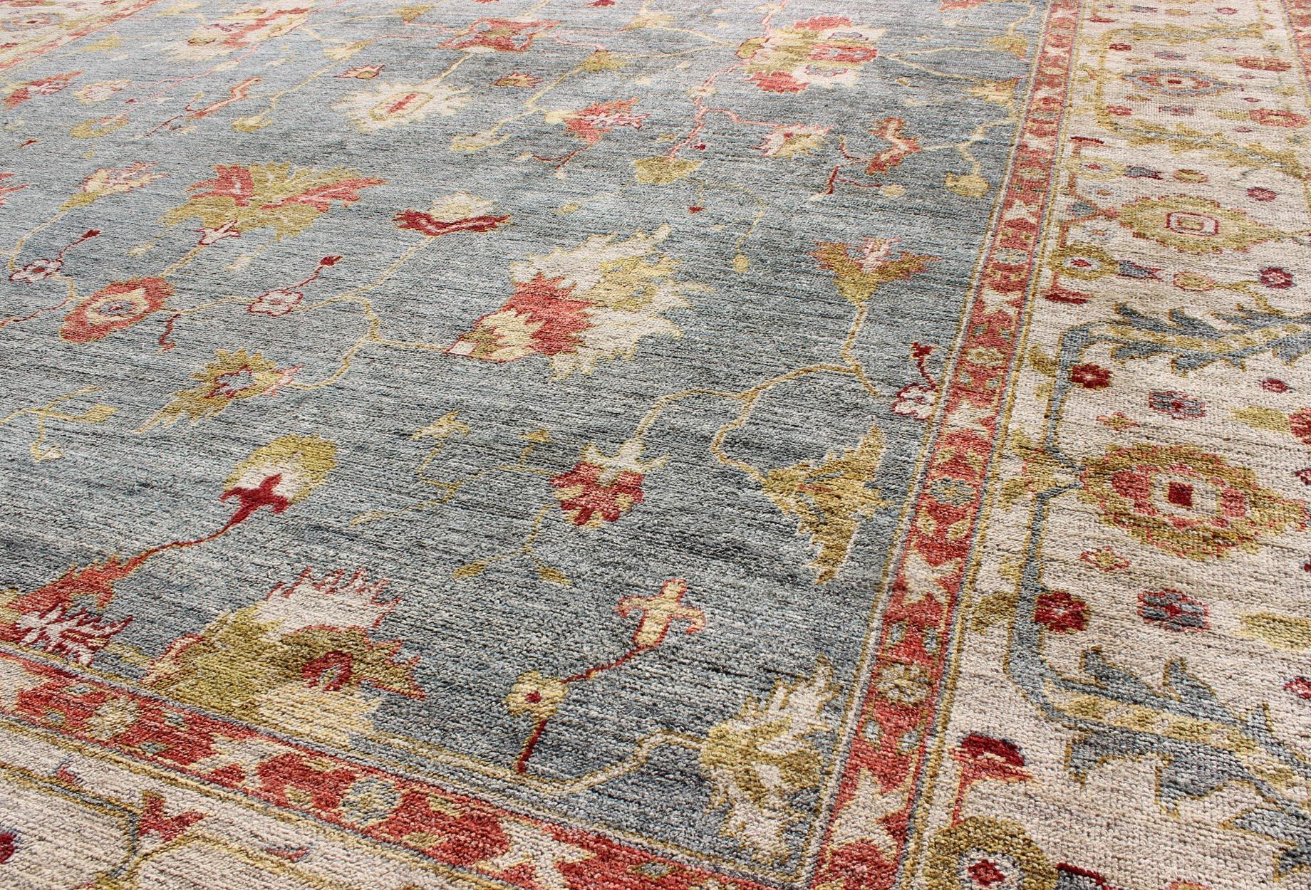 Contemporary Large Angora Turkish Oushak Rug in Blue Background and Ivory with Hints of Red For Sale