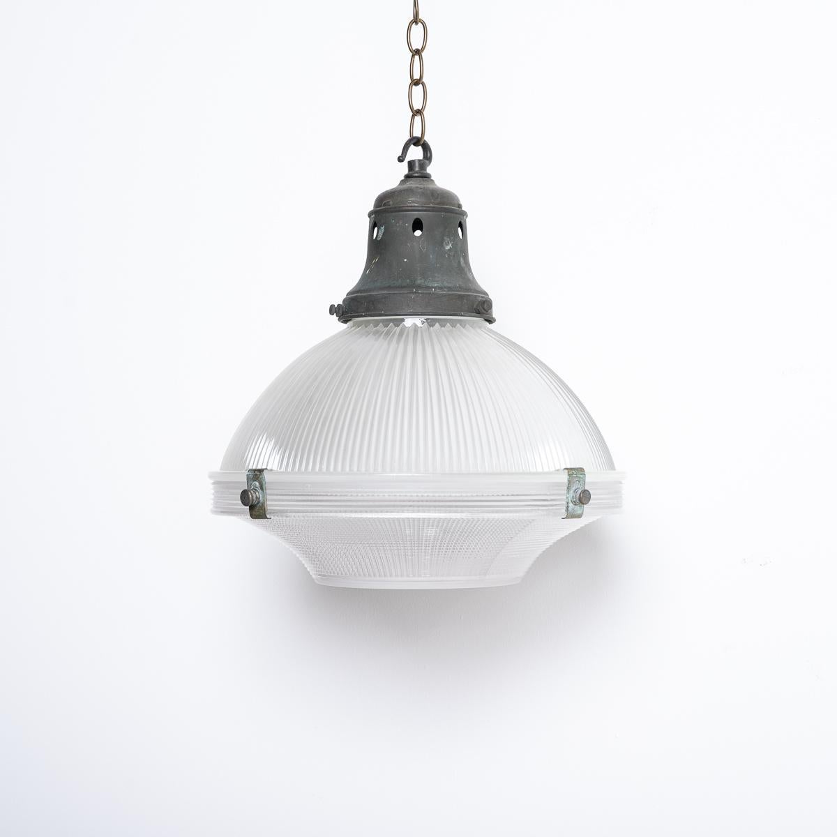 A RARE RUN OF MEDIUM HOLOPHANE THREE PART PENDANT LIGHTS 

PRICE IS PER LIGHT

A stunning set of three vintage Holophane pendant lights reclaimed from an abandoned 150 year old chapel originally built in 1876 in the heart of Gwynedd village in