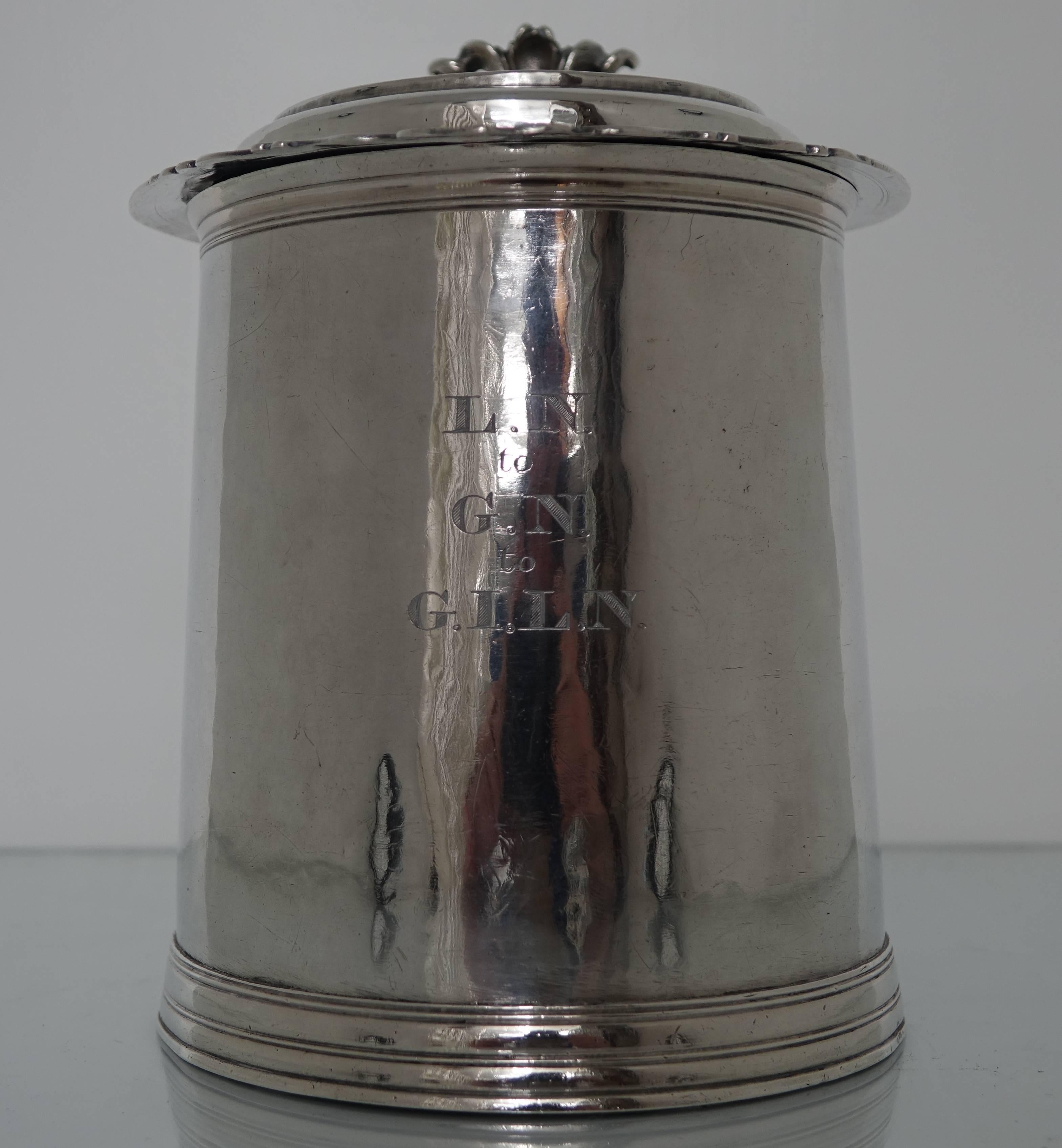 A very rare, large, William & Mary silver tankard with a hinged cover. Boasting a cylindrical, plain, hammered body, typical of the period, with extremely rare teardrop beading on the lid and handle. The tankard has an excellent patina and a