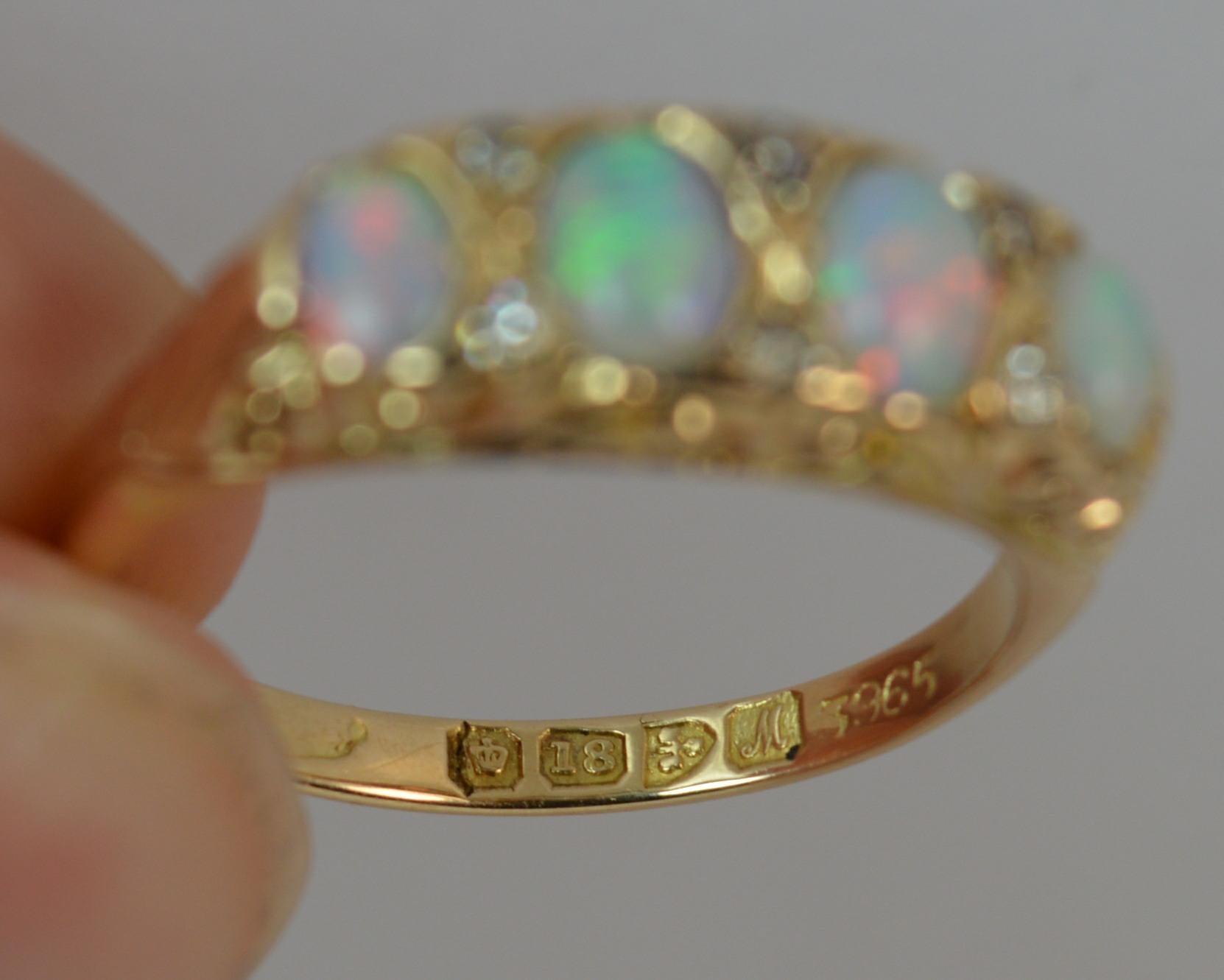 
A beautiful true antique Opal and Diamond ring.

Ideal stack or half eternity ring.

Designed with four natural oval shaped opals, full or colour with pairs of natural diamonds in between.

18mm x 6.5mm head. Pierced head setting. Protruding 4.2mm