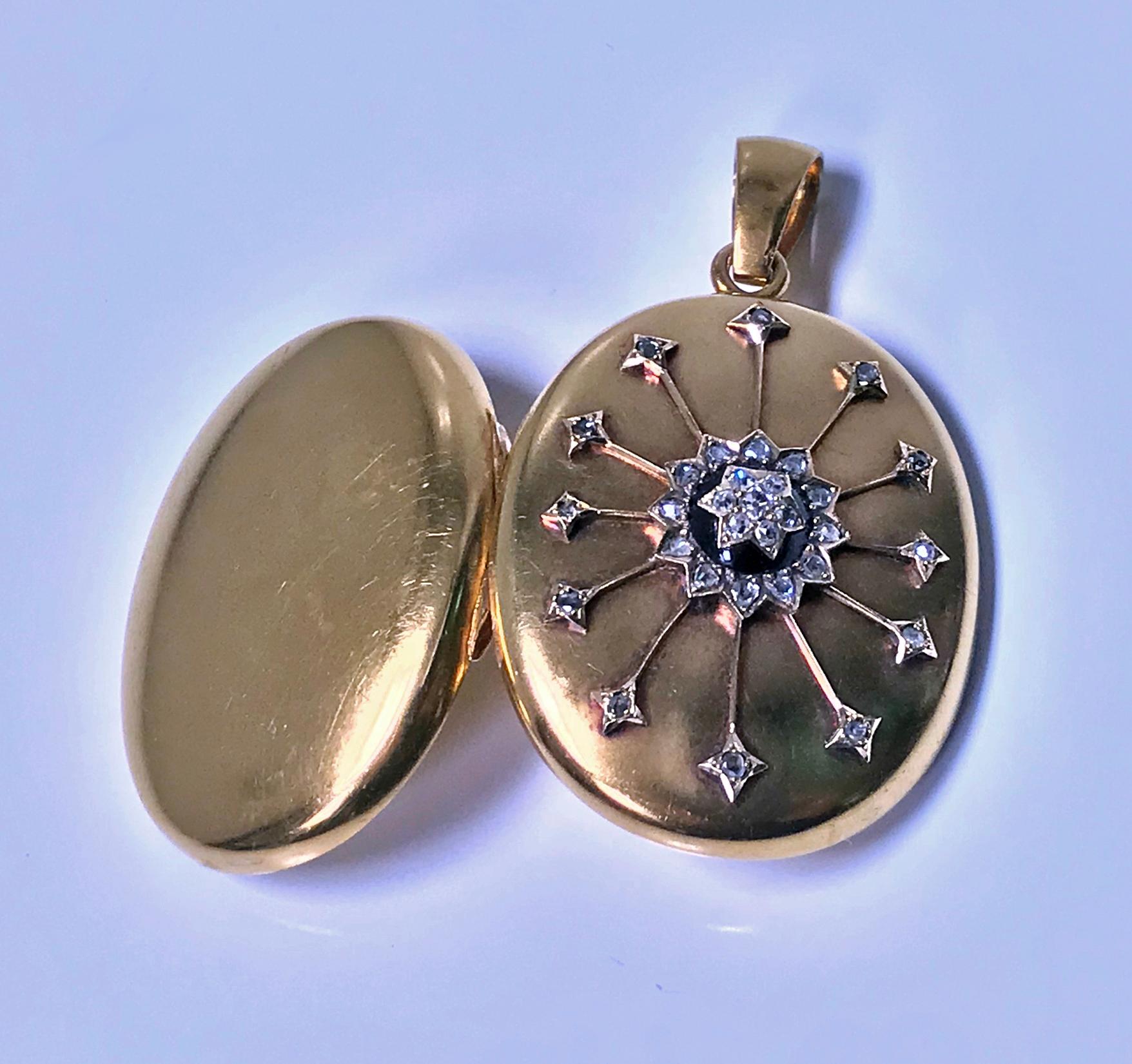 Antique 18K Diamond large Pendant Locket, C.1860. The front with diamond star set centre surmounted on black onyx and diamond surround with applied gold diamond set rays extending outwards, thirty one mixed old mine cut and rose cut diamonds, all on