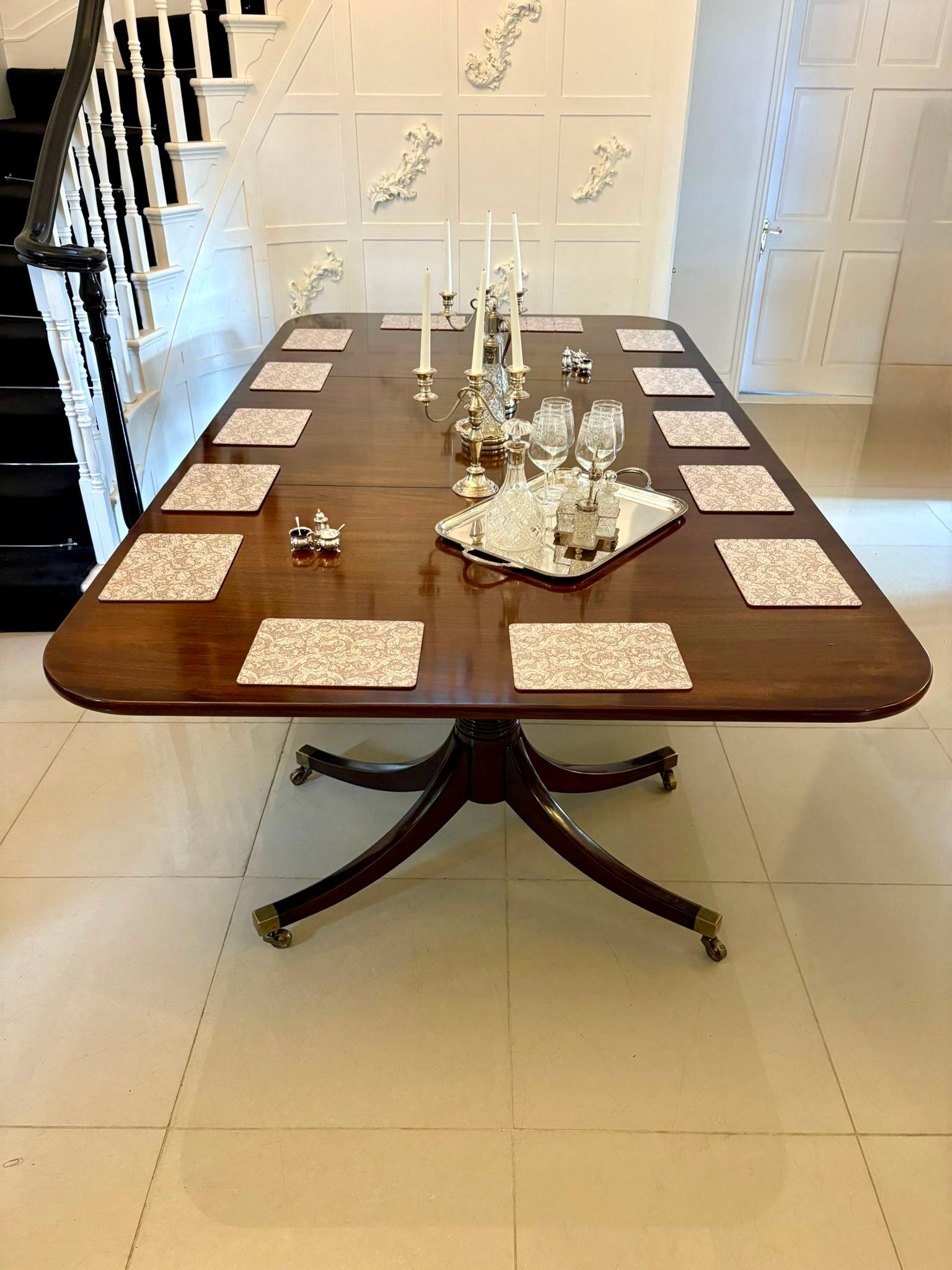 Large antique Edwardian 18 seater superb quality figured mahogany 3 pilar dining table having an outstanding quality figured mahogany top with 2 original extra leaves supported on 3 elegant turned pedestal columns standing on 4 splayed sabre legs