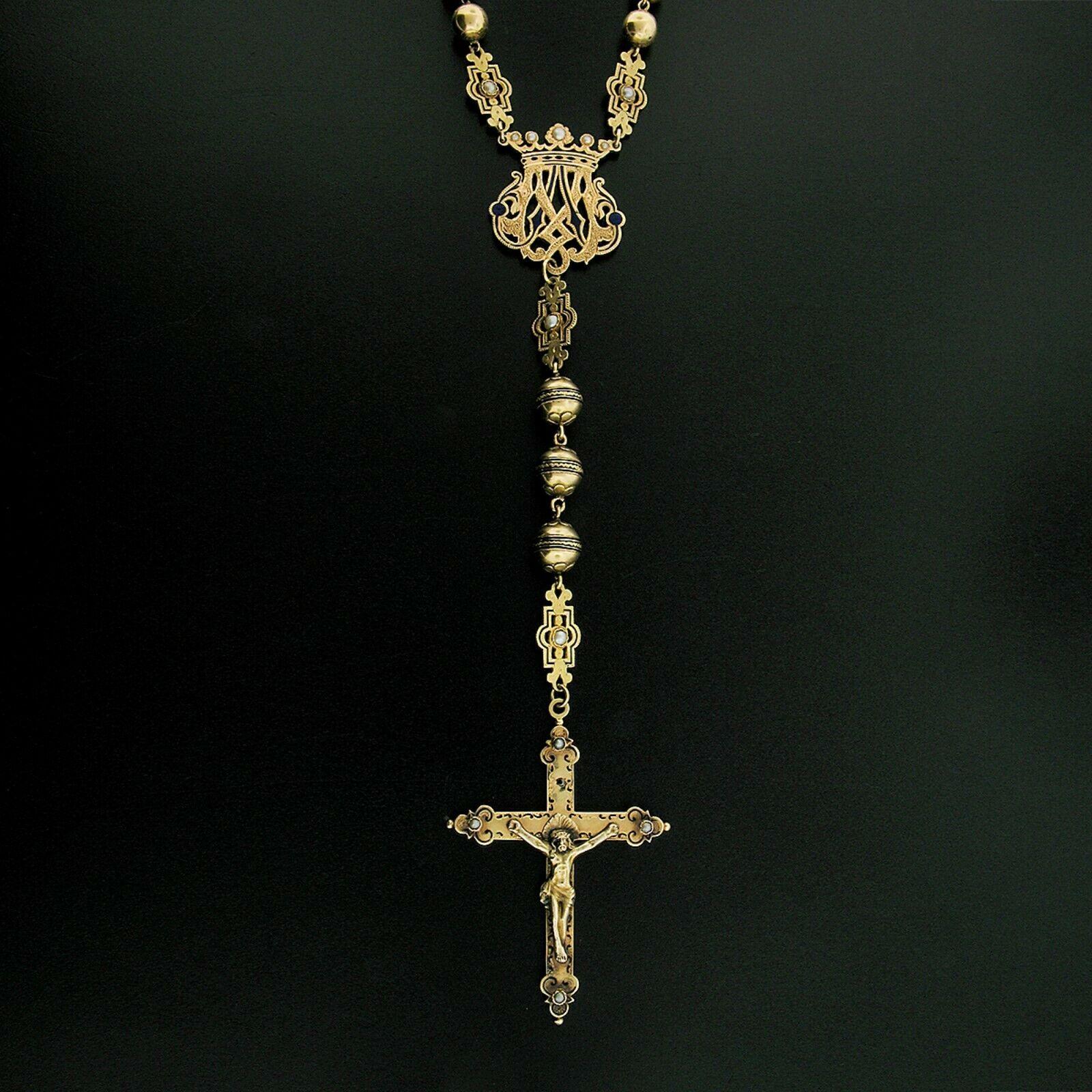 This substantial antique rosary was crafted from solid 18k yellow gold and features absolutely incredible detail including hand etched work and black, white, and blue enamel throughout. The chain consists of gold beads that show delicate hand etched