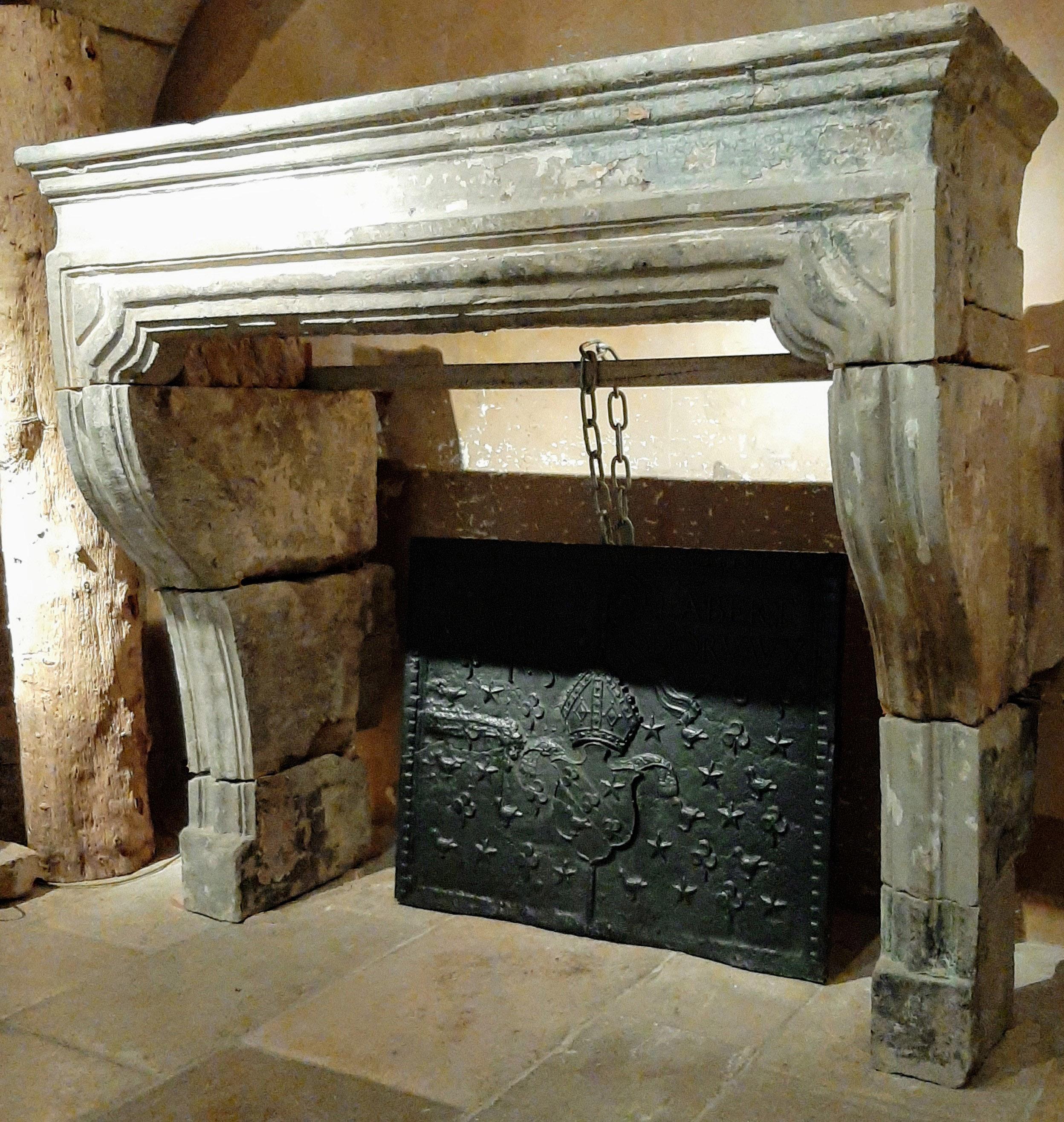 Stunning antique limestone / sandstone / sand-lime fireplace, from the 18th century France Baroque, where you can still see the old patina residues. 

Dimensions: H 155 x W 175 x D 90 cm 
Dimensions inside: H 120 x W 135 cm
Dimensions return: 50