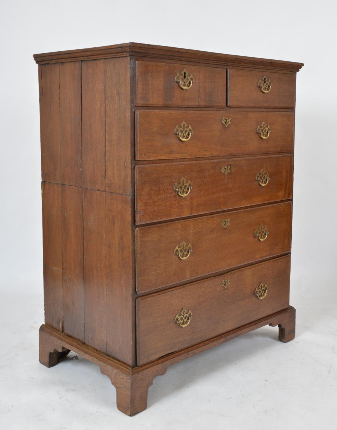 A very tall and highly attractive 18th-century Georgian oak chest of two over four graduated drawers, with beautifully figured oak, brass handles, and escutcheons, raised on bracket feet. The four quarter sawn oak graduated drawers, run nice and