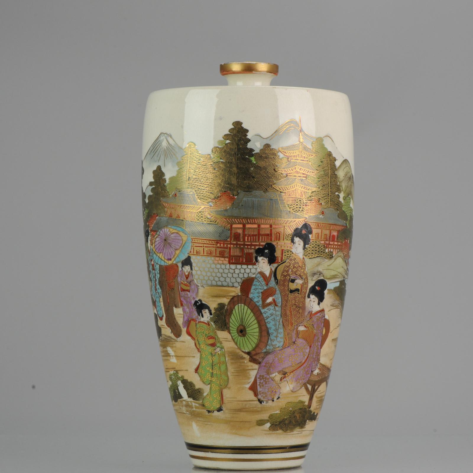 Fabulous Satsuma vase with a circular mountainious landscape scene with a bridge and ladies in a pagode garden.

Condition
Overall condition some spots of enamel loss on the body, besides a hole in the base. Size: approx. 300mm high and 150mm