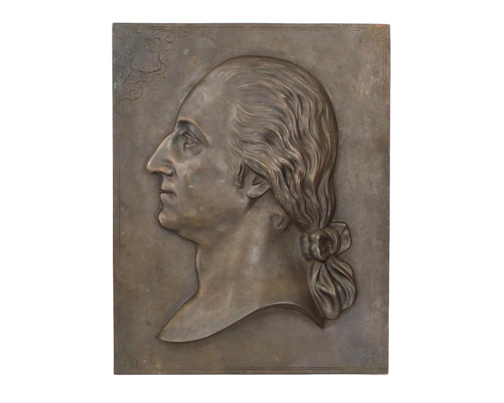 A finely cast antique American 19th century bronze plaque with a relief profile of George Washington. Unsigned. The American Union flag shield is engraved on the top left. Note: George Washington was an American Founding Father, military officer,