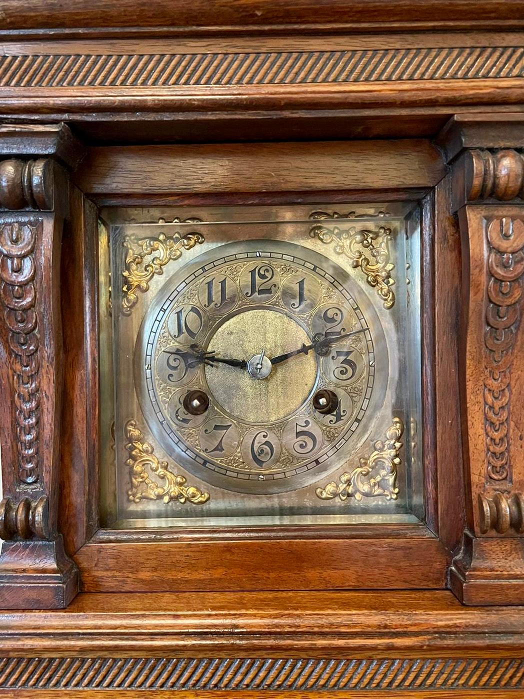 Large 19th century antique carved walnut brass face eight day bracket clock having three carved turned walnut finials and a carved walnut arch reeded top with square brass face and a silvered chapter ring, original hands and eight day ting tang