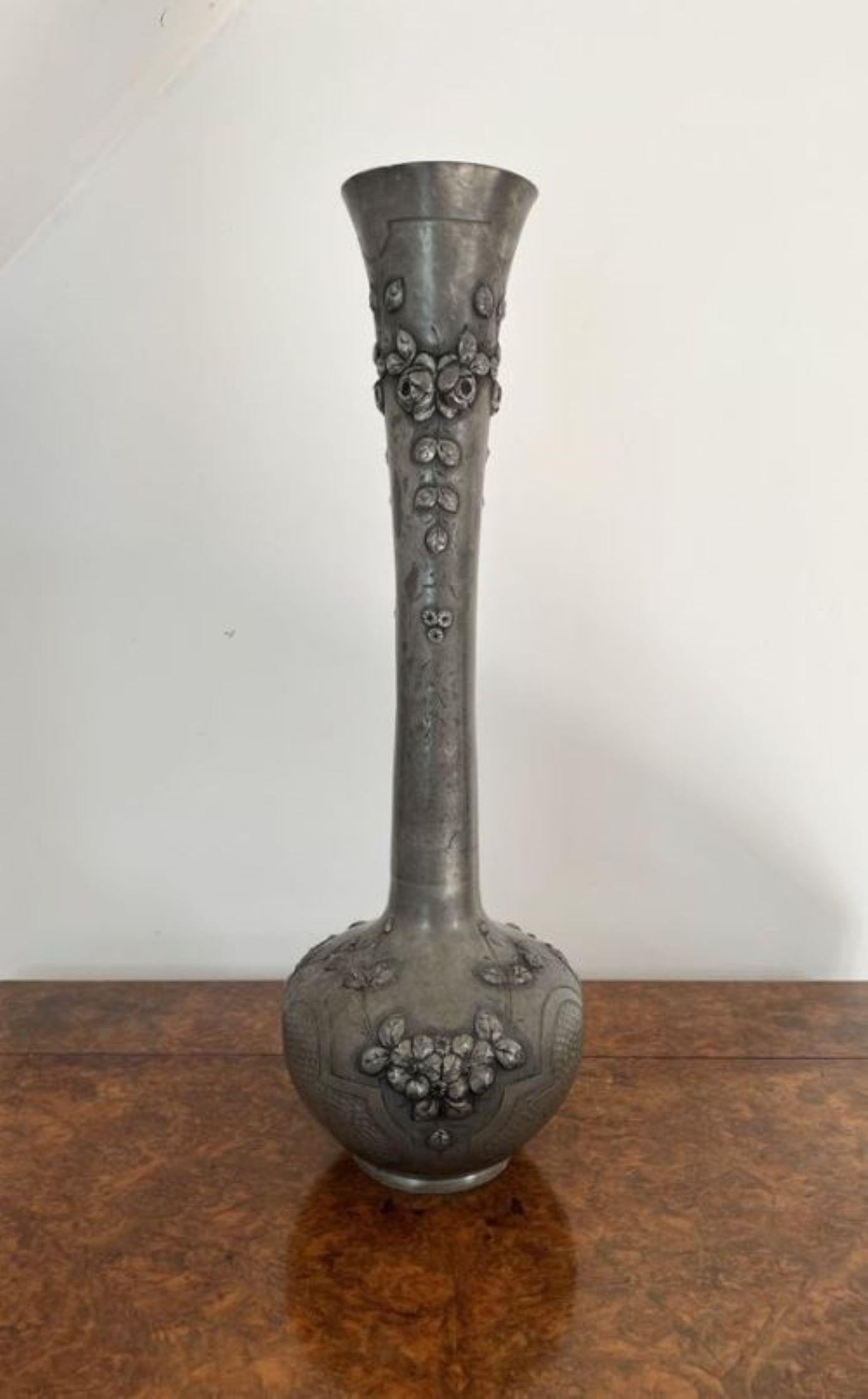 Large antique 19th century French quality pewter vase having a quality 19th century French large pewter vase with stunning embossed flower detail, with a bulbous body and a fluted neck.