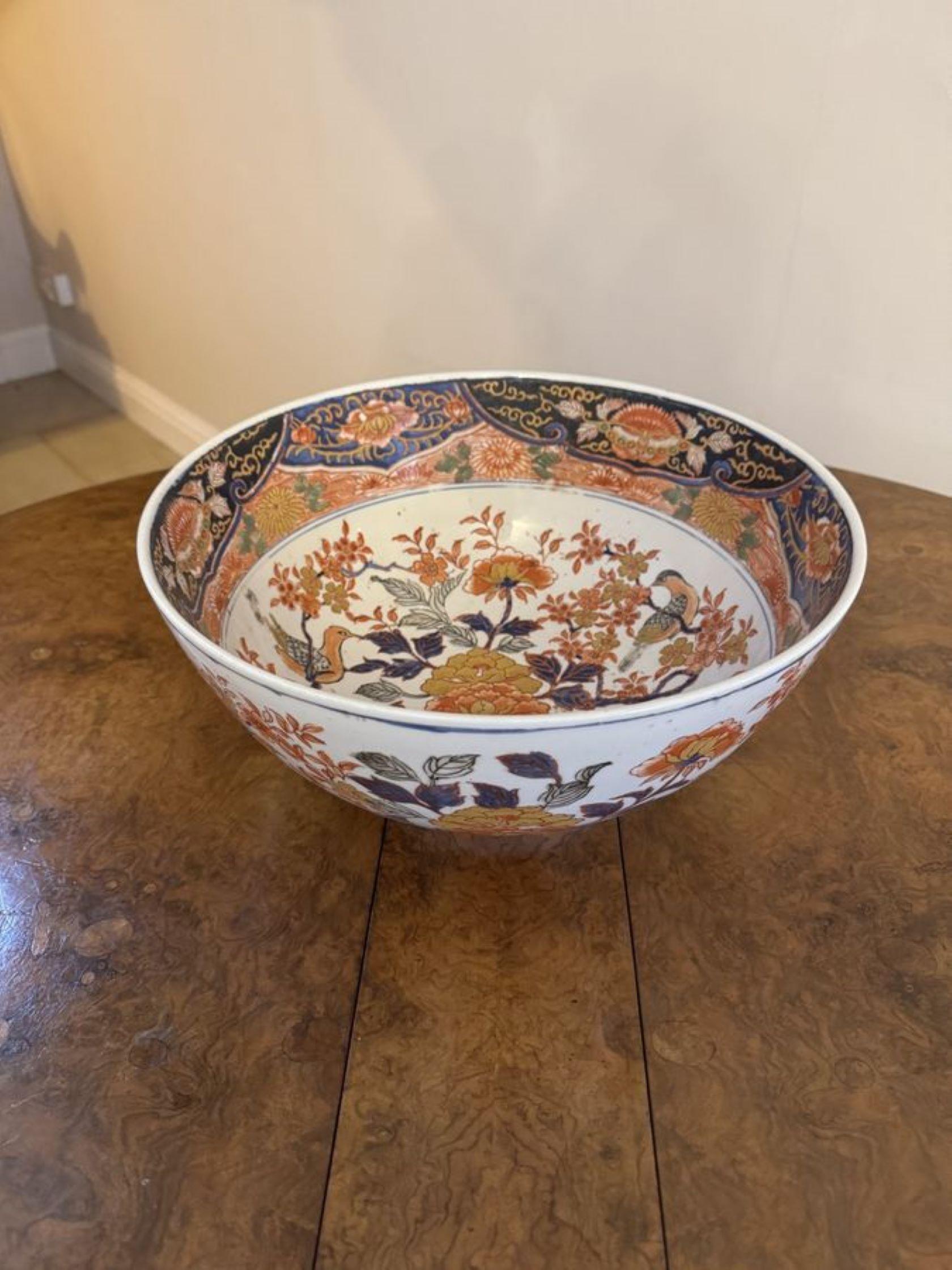 Large antique 19th century quality Chinese porcelain bowl, having fantastic floral decoration throughout in wonderful red, orange, blue, yellow and gold colours on a white ground. 

D. 1850