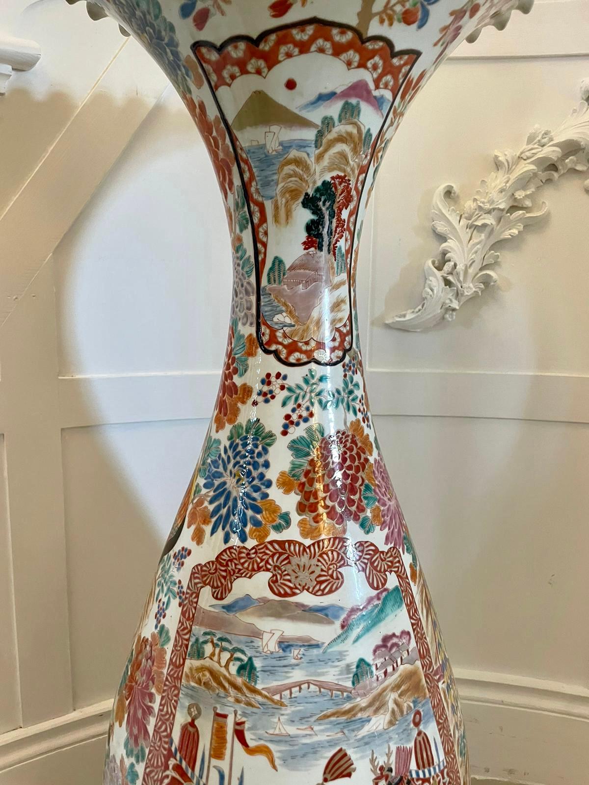 Large antique 19th century quality Japanese Imari floor standing vase having a splendid trumpet shaped scalloped edge top, fantastic hand painted panels with Japanese people in period clothing, trees, houses, birds, deer’s, dogs of goo and