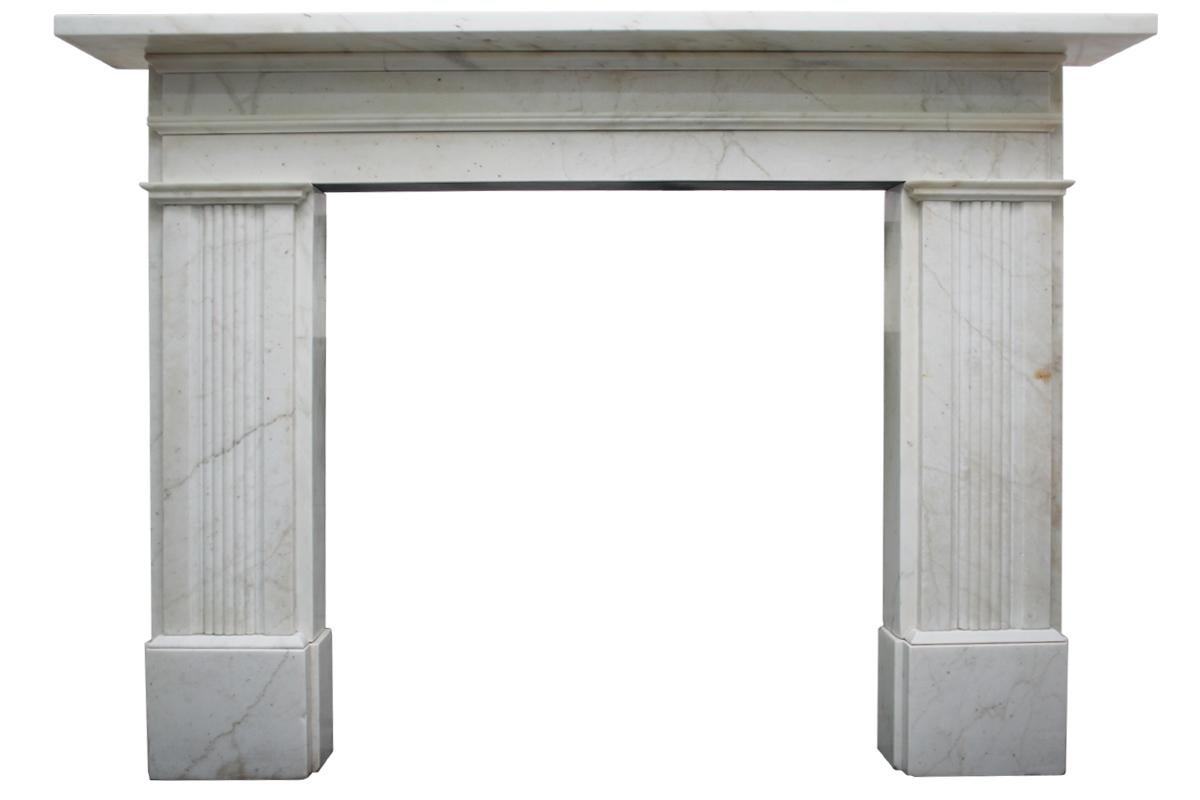 Large antique 19th century Victorian white marble fireplace with reeded legs and sectioned frieze. Circa 1850. Removed from a fine property in Liverpool. 

Pictured with a rare large antique Victorian arched fireplace grate of simple form with