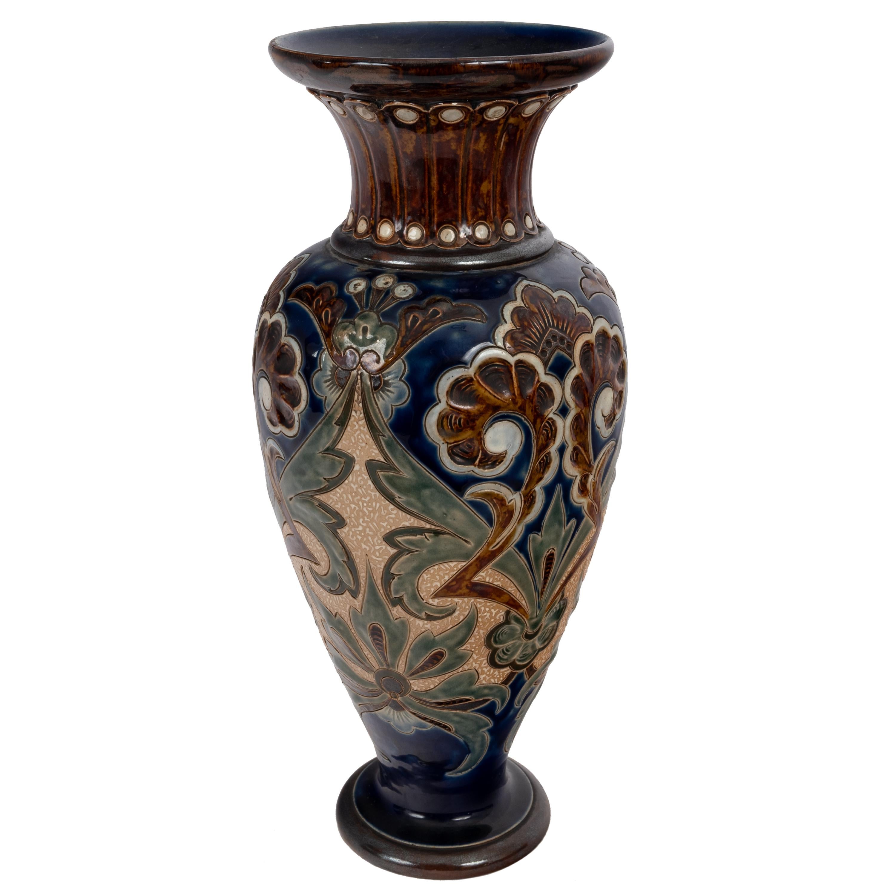 A good large antique Aesthetic Movement Doulton Lambeth stoneware pottery vase, 1883.
The vase decorated in the Aesthetic taste, with an complex incised design and rich glazing. The base having the Doulton Lambeth mark dating from 1882-1891 and the