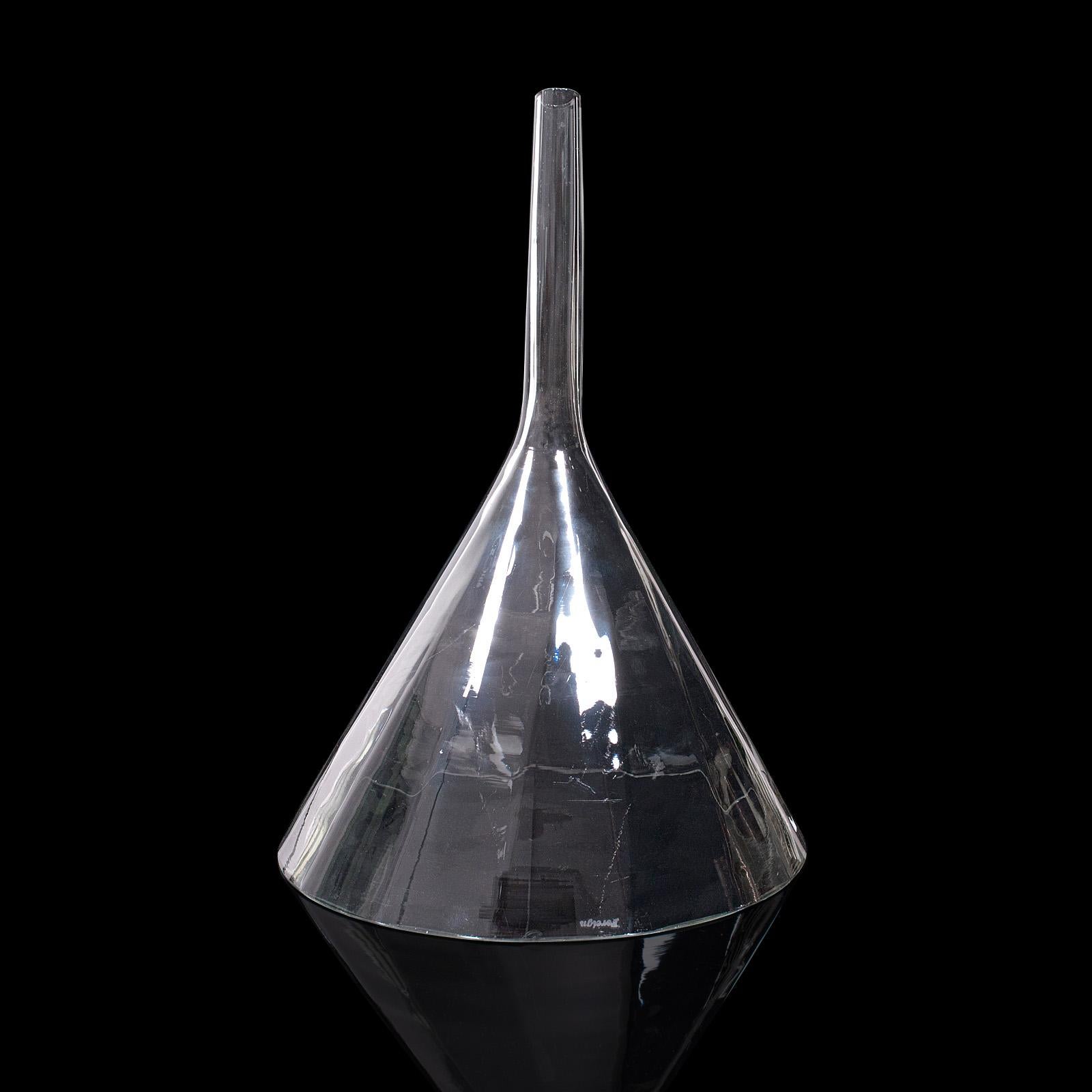 This is a large antique apothecary funnel. A Continental, glass chemist's funnel, dating to the Edwardian period, circa 1910.

Of superb size and of display interest
Displays a desirable aged patina throughout
Faceted glass cascades into a