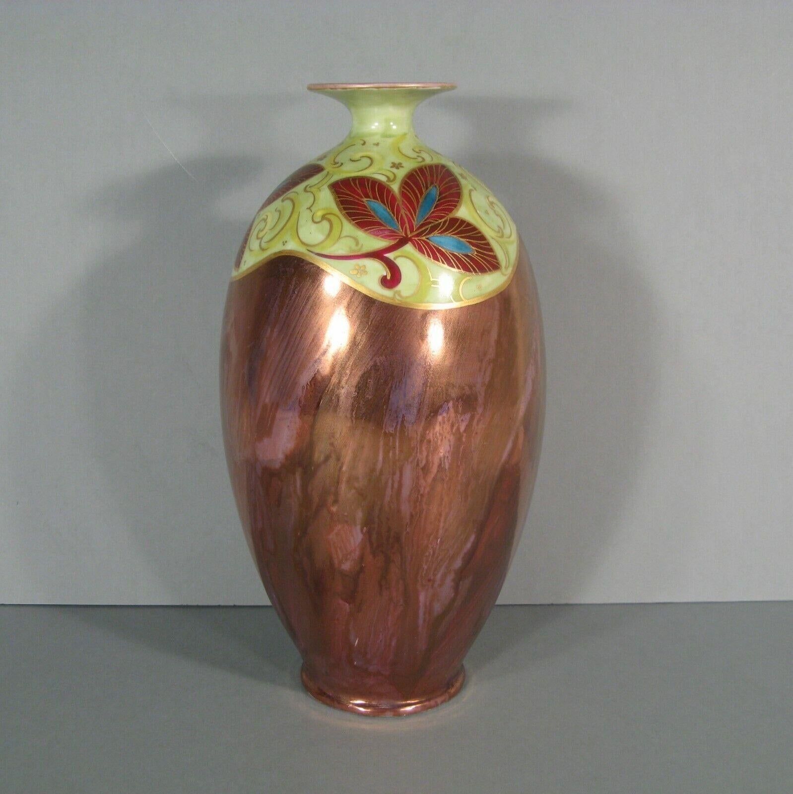 Introduce a touch of vintage elegance to your home with this stunning large Art Deco porcelain vase from Limoges. Crafted in the 1930s by the renowned Delinières & Co. (D&C°) manufacture, this vase features a striking metallic luster effect and is