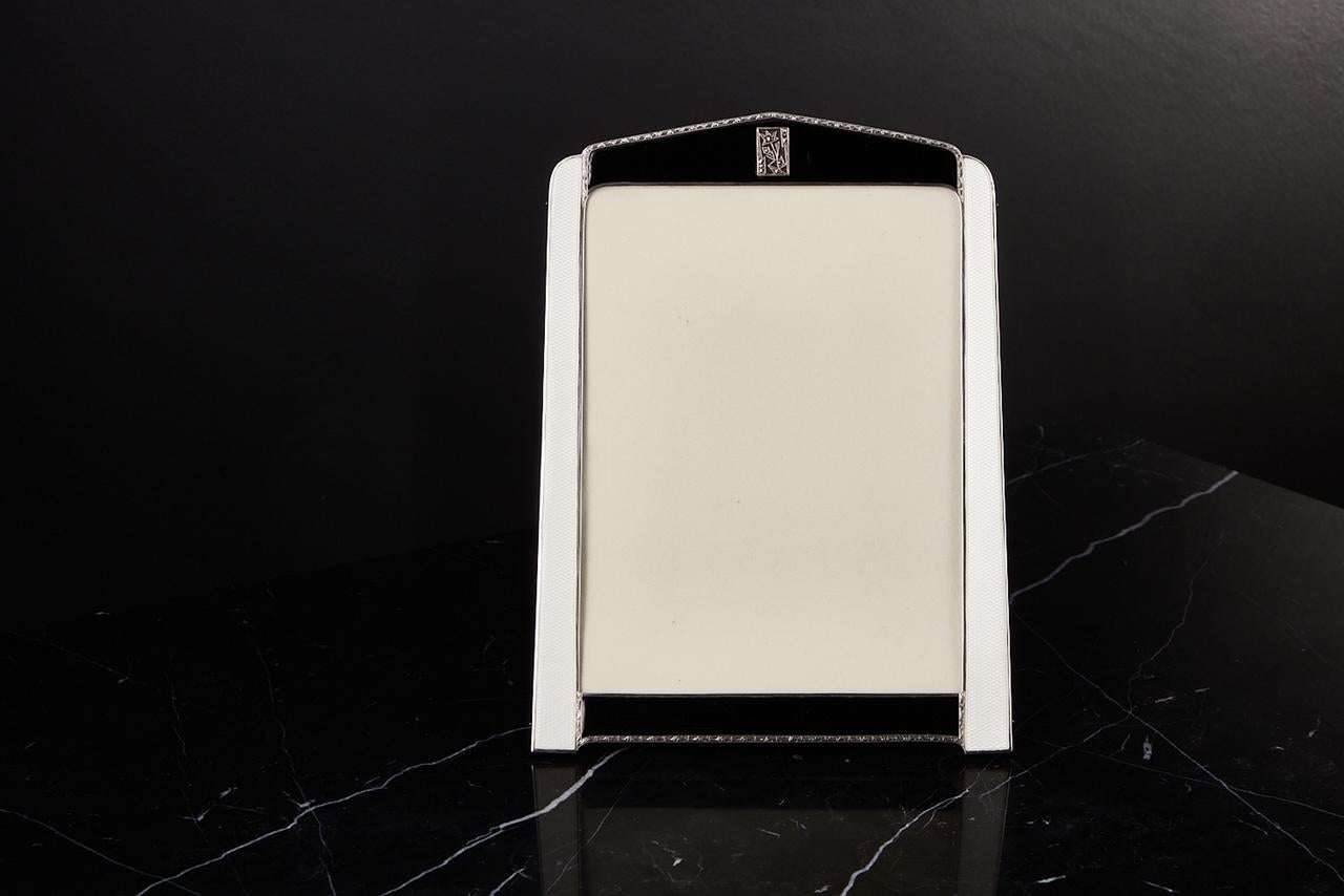 A Large Rare Art Deco Sterling silver & Enamel photograph frame Made in Birmingham 1929 Makers Asprey & Co,

Beautiful quality in a pure Art Deco form. The colour both the silver & enamel are in excellent condition. The very fine silver to the