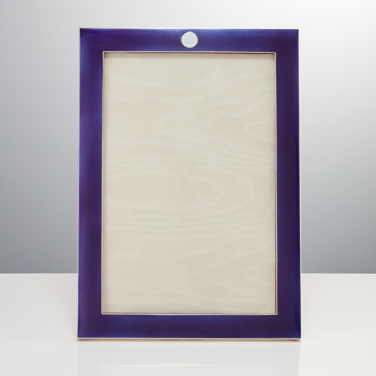 A stunning quality sterling silver & enamel picture or photo frame. 
The enamel colour could be described as a deep and rich amethyst.
The enamel remains bright and clean with no noticeable blemishes or damage.
The heavy gauge silver gives it that