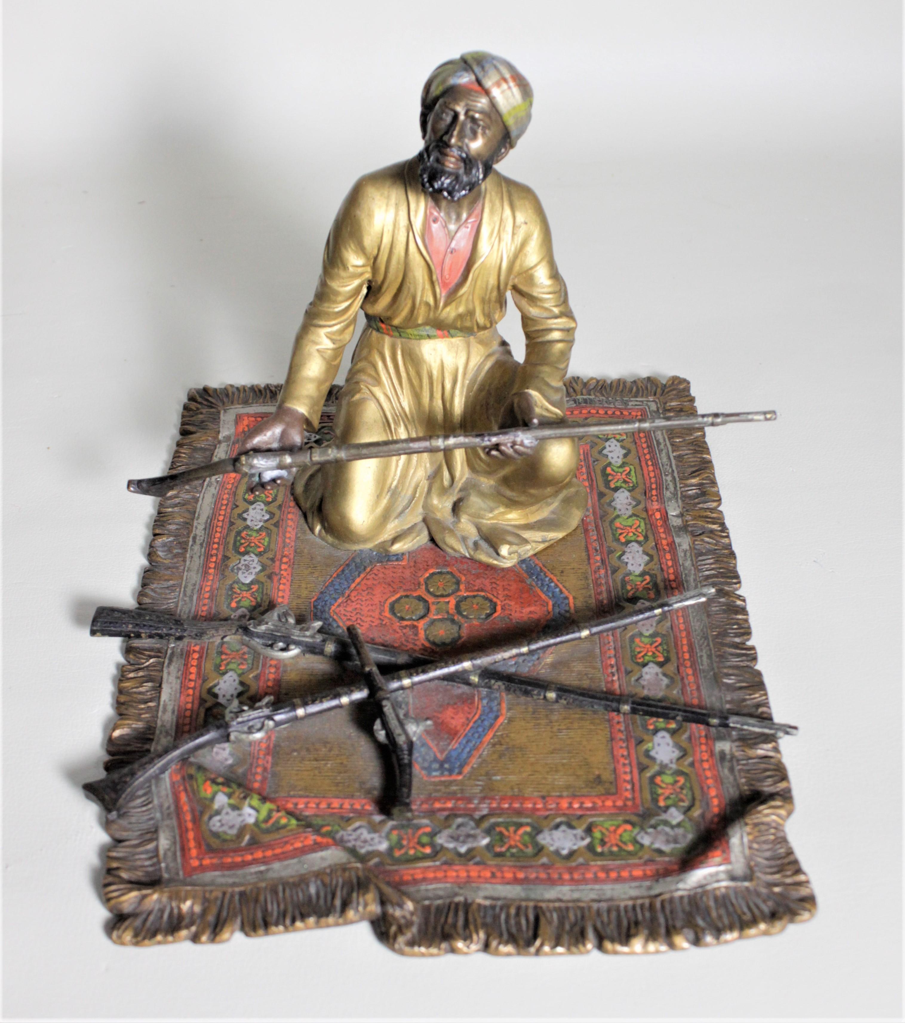 This cold painted Austrian bronze dates from the late 19th century and is extremely detailed. The figure is signed, or titled on one edge of the carpet, but we could not determine the maker and have posted it as Unknown. This very intricately cast