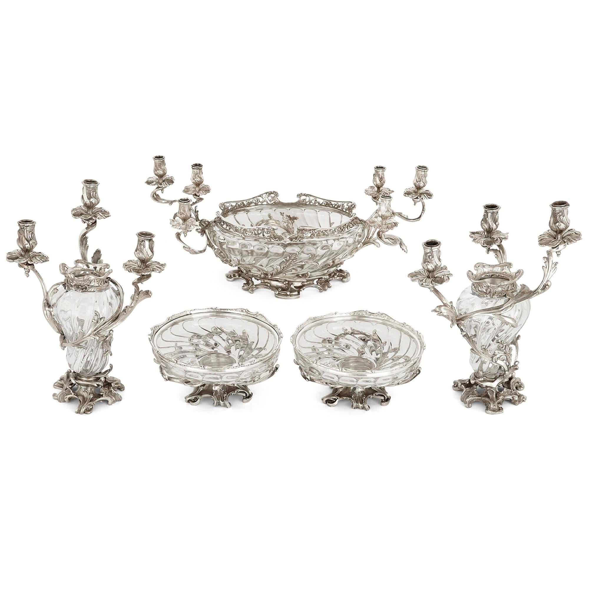 Large antique Austrian silver and glass garniture by Schwarz & Steiner 
Austrian, Late 19th Century 
Centrepiece: Height 29cm, width 70cm, depth 29cm
Candelabra: Height 39cm, width 28cm, depth 23cm
Dishes: Height 12cm, diameter 25cm

This