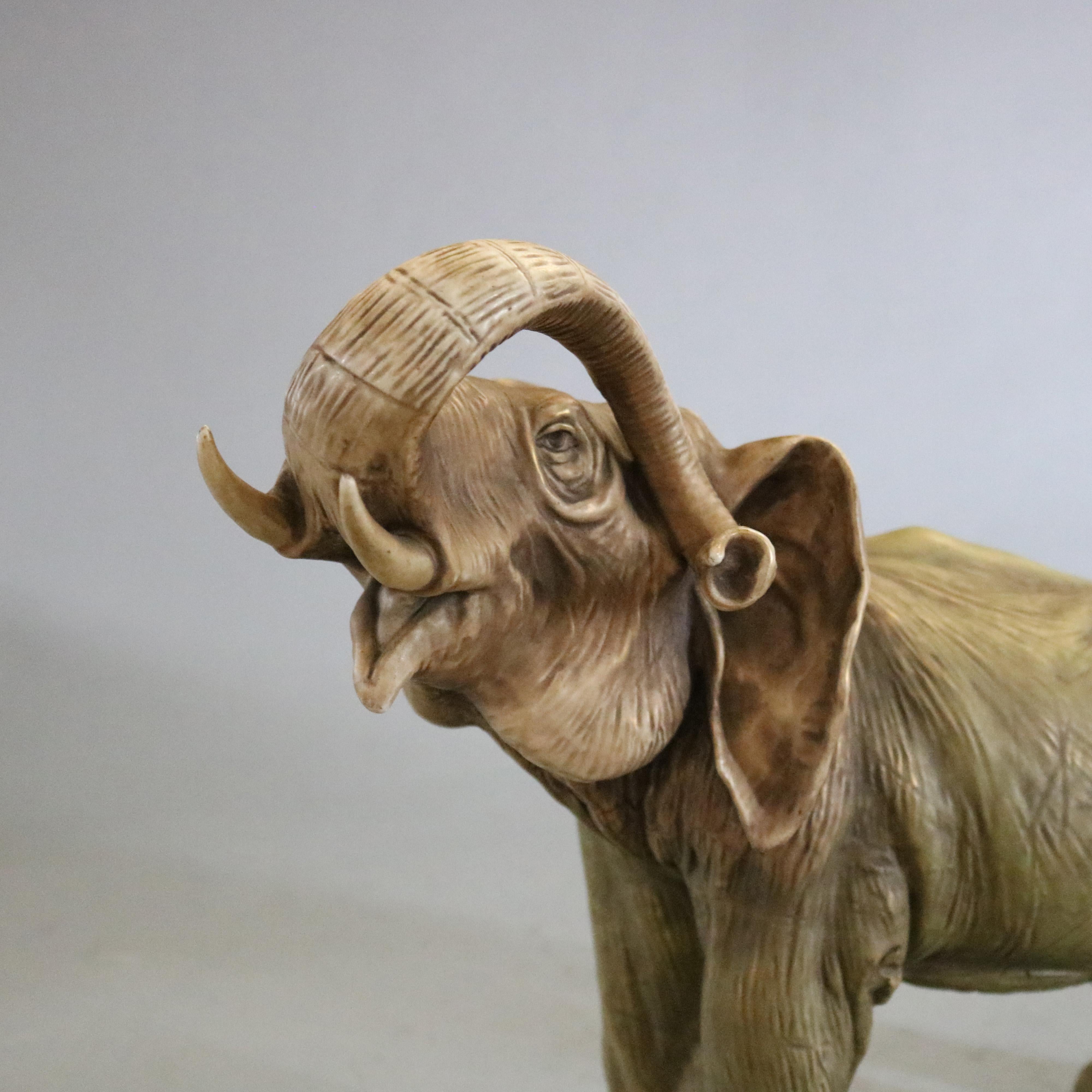 An antique, large and well cast Teplitz Amphora figural pottery statue depicts a highly detailed standing elephant with raised trunk, c1900

Measures- 13