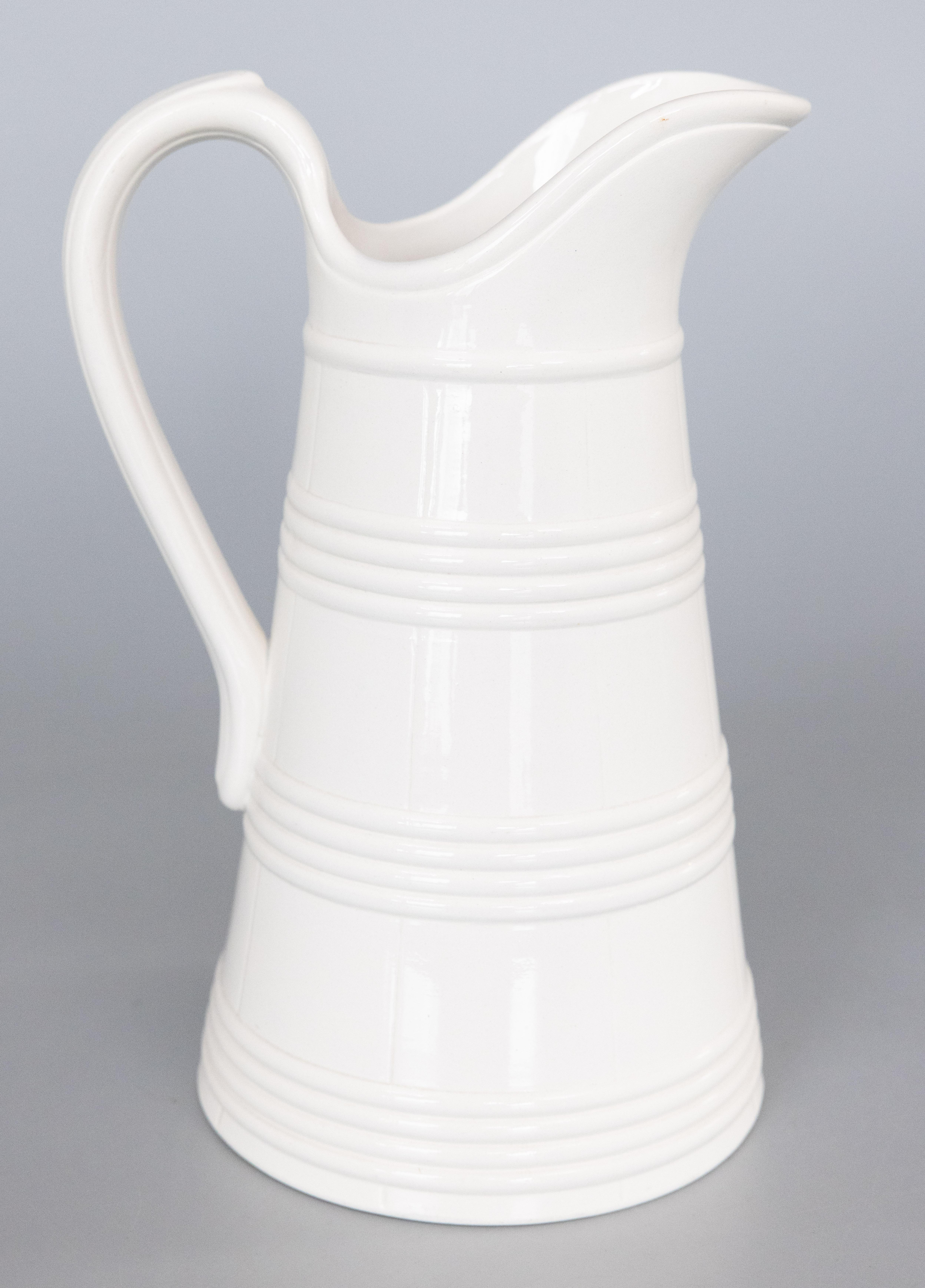 A lovely large antique Belgian white ironstone pitcher, circa 1880. Made by Boch La Louviere, in Belgium, signed on reverse. This fine quality pitcher is a nice large size measuring 13.5 inches tall and has simple clean lines, perfect for the modern