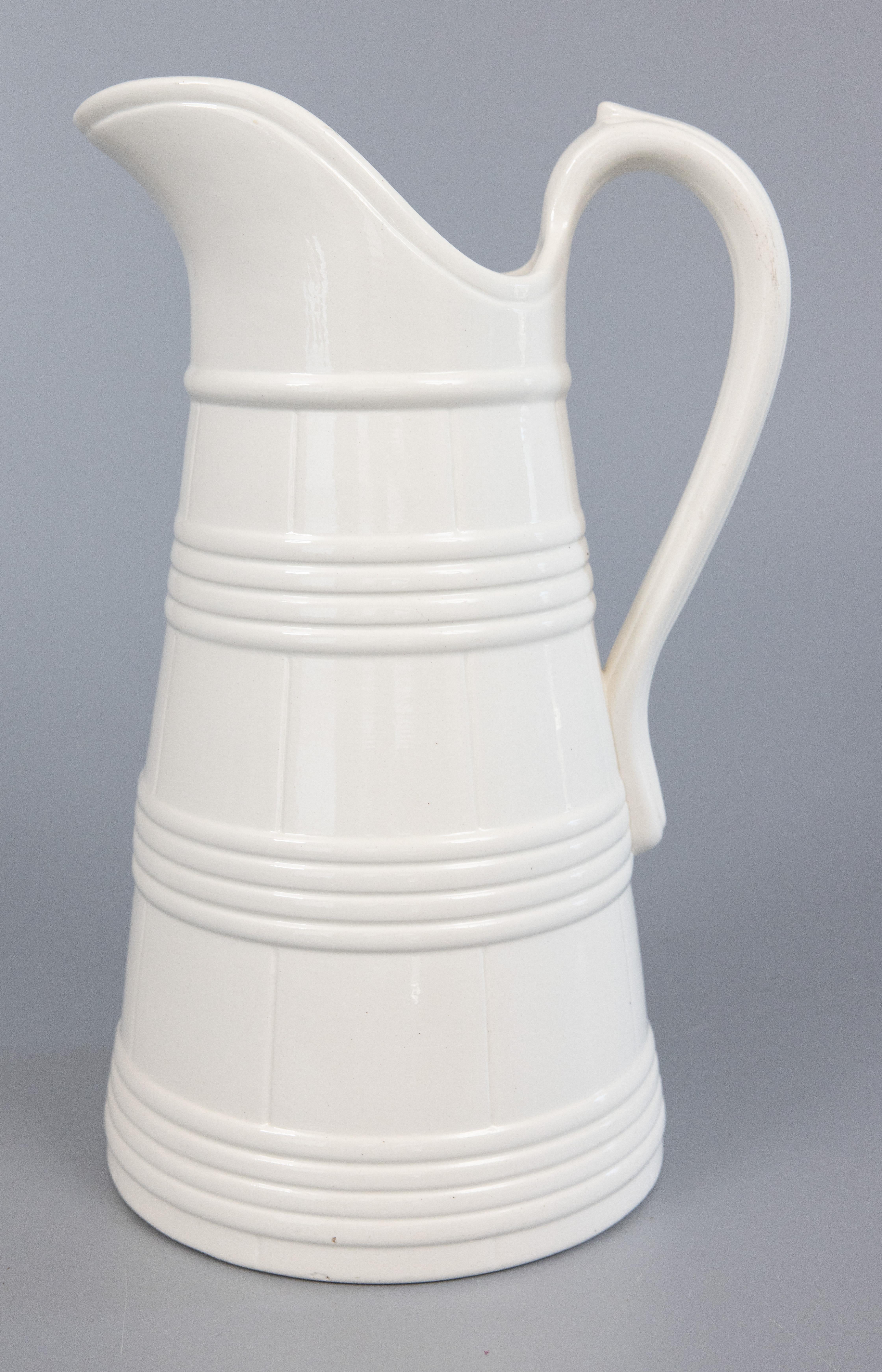A lovely large antique Belgian white ironstone pitcher, circa 1890. Marked 