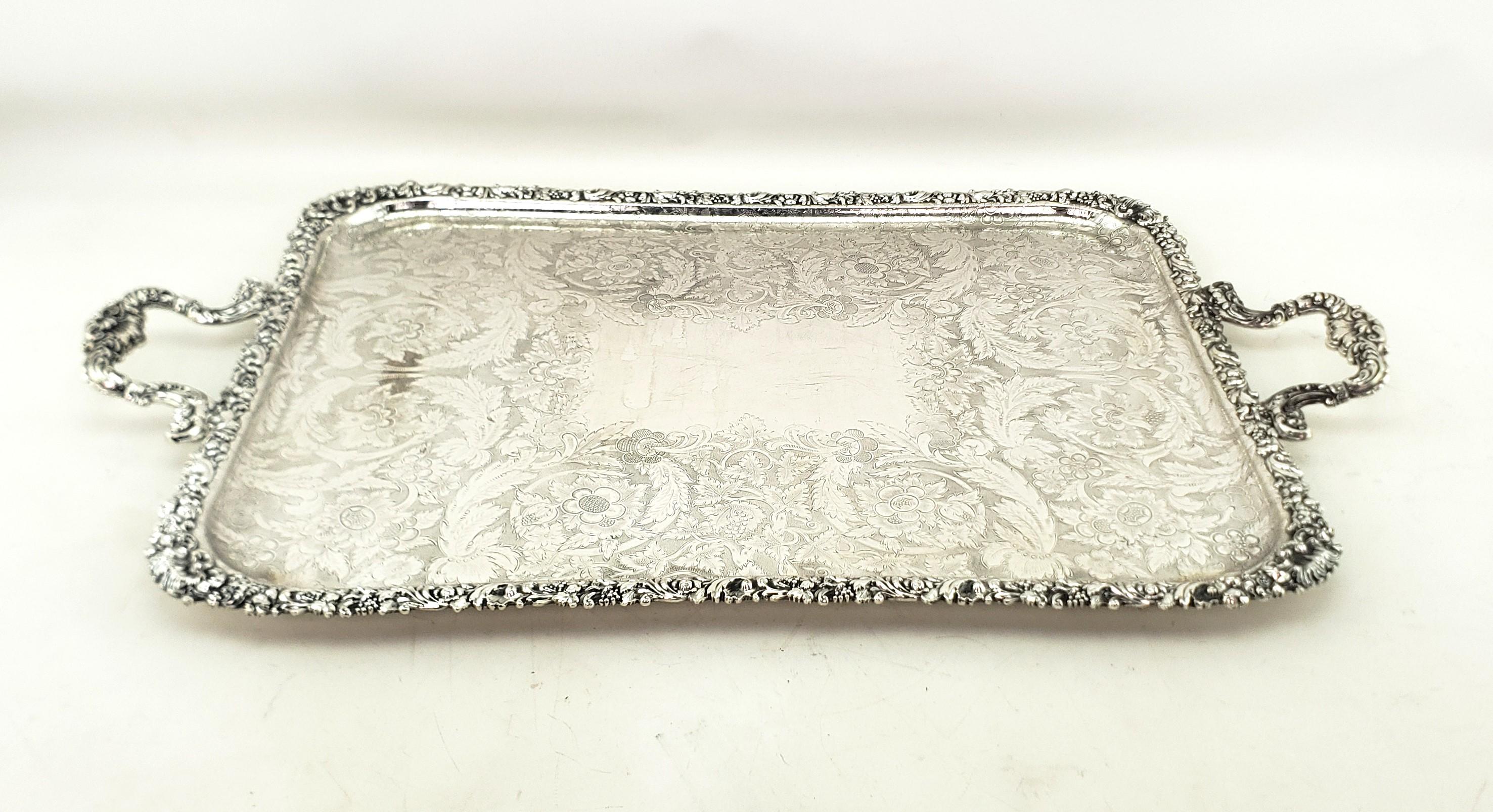 This very large and substantial antique serving tray was produced for the renowned Birks retailers by an unknown maker from England and dates to approximately 1880 and done in the period Victorian style. The tray is composed of Birks signature