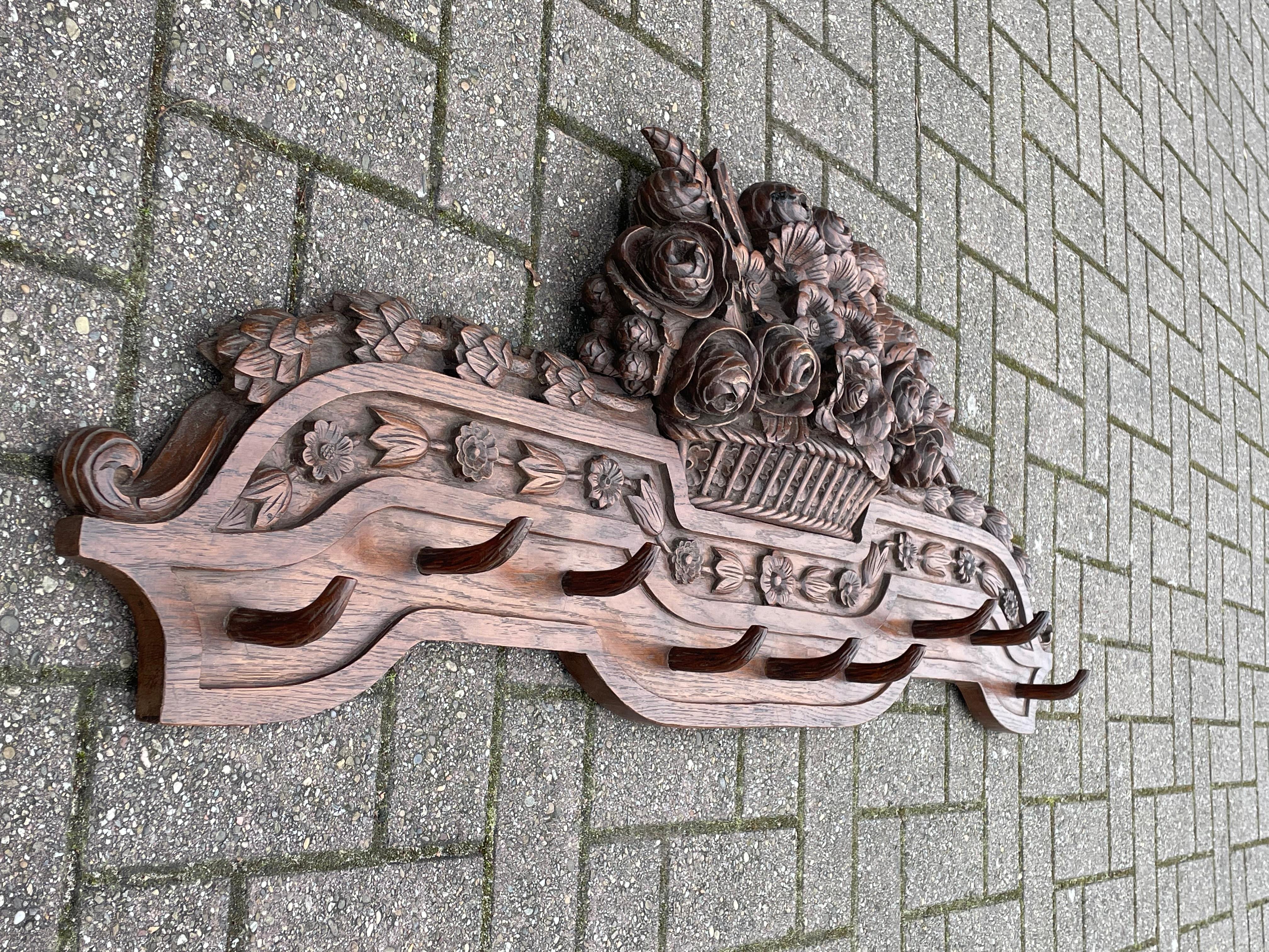 European Large Antique Black Forest Wall Coat Rack w. Hand Carved Basket of Flowers 1890s For Sale