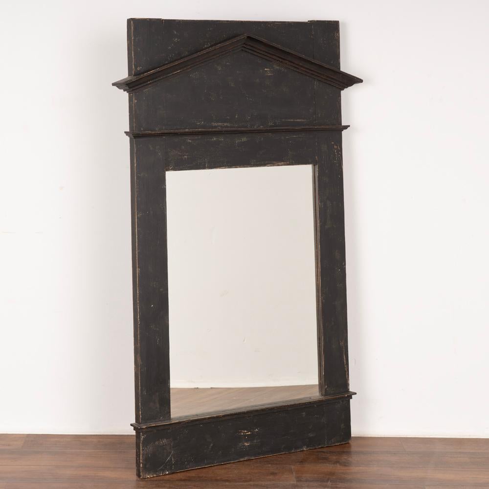 Large black painted mirror with architectural feel, molding reflects the lines of a rooftop.
Newer professionally applied black layered painted finish with slight distress to reflect age.
Restored, strong and ready to hang. Any cracks, scratches