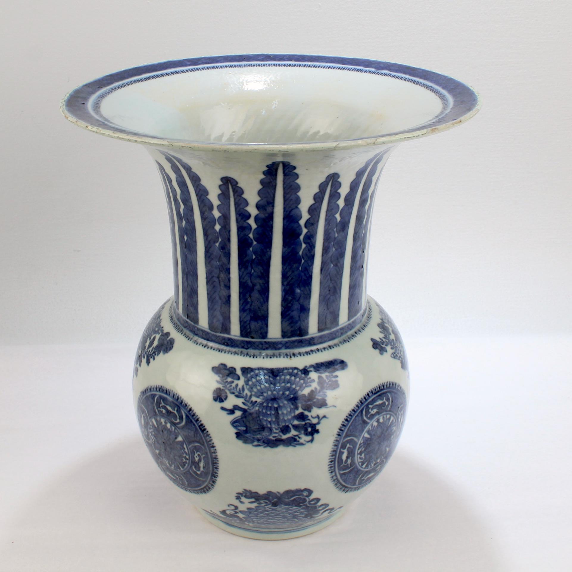 A fine antique Chinese export porcelain vase in the Fitzhugh pattern.

Decorated in underglaze blue with a trellis-diaper border with spearheads and dumb-bells to the rim, with fronds and the repeated trellis-diaper device to the neck, and with
