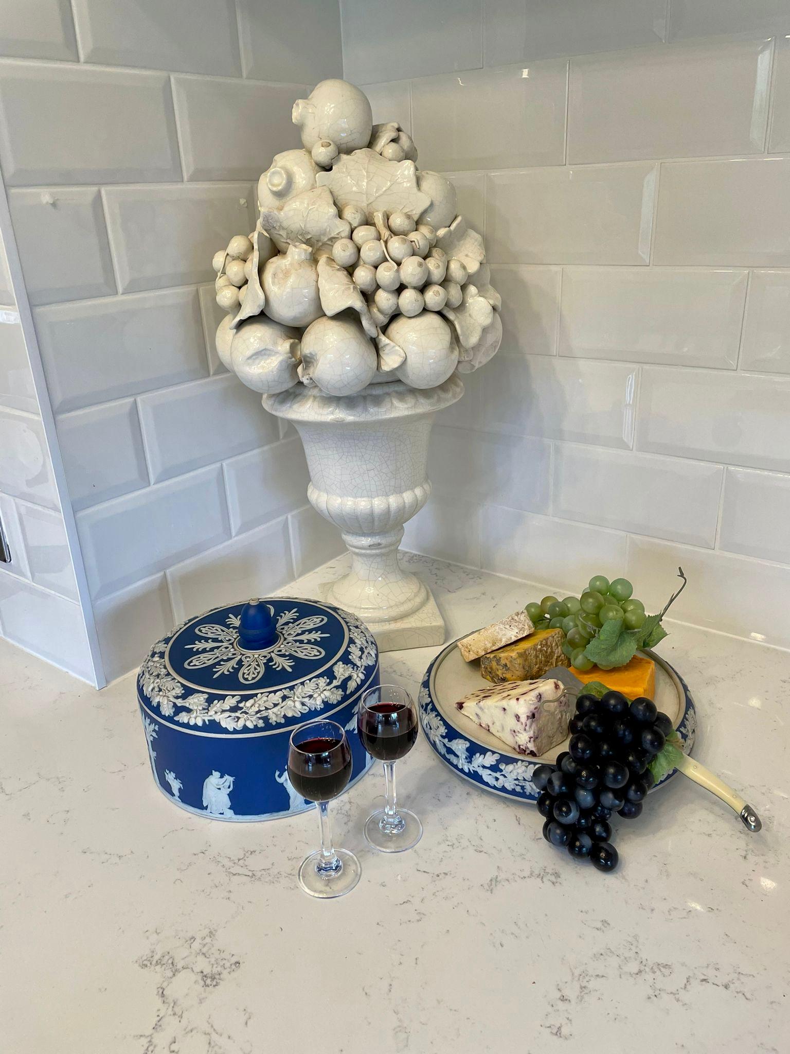 Large antique blue & white Wedgwood Jasperware cheese dish having a stunning large blue and white dome lift of lid with an acorn shaped knob to the top with traditional decoration standing on the original round blue and white base.

A marvelous