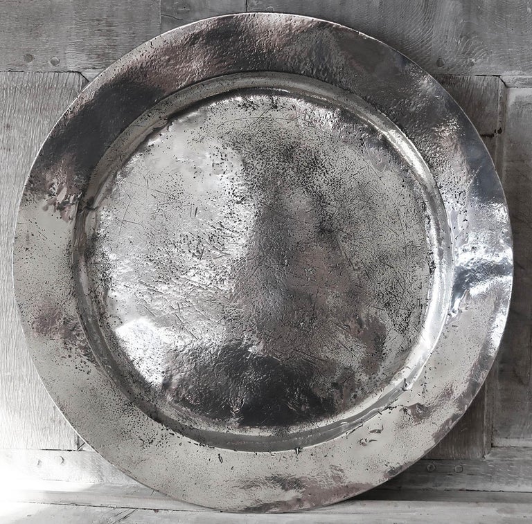 Wonderful highly polished pewter charger. Measures: (20 inches).

Amazing distressed patina

English, Mid-18th Century. Most likely, London

The pewter has been polished to its original shine to imitate polished silver. It was known as the