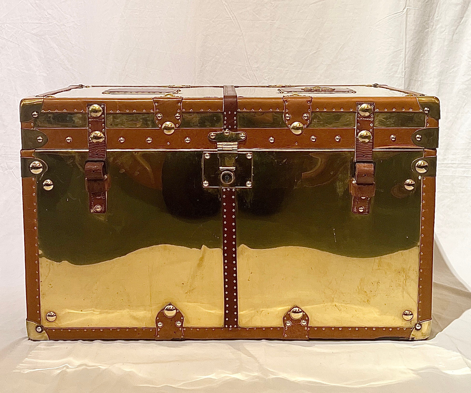 Large Antique British Leather & Brass Military Trunk, Circa 1910's-1920's.
This trunk is from the Home Counties Regiment, part of the Territorial Forces protecting England during both World Wars. In warfare the Regiment was a frontline infantry