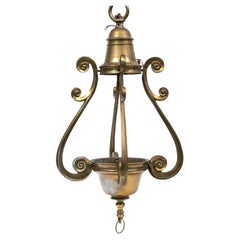 Grand luminaire en bronze antique provenant d
un paquebot de luxe français à restaurer