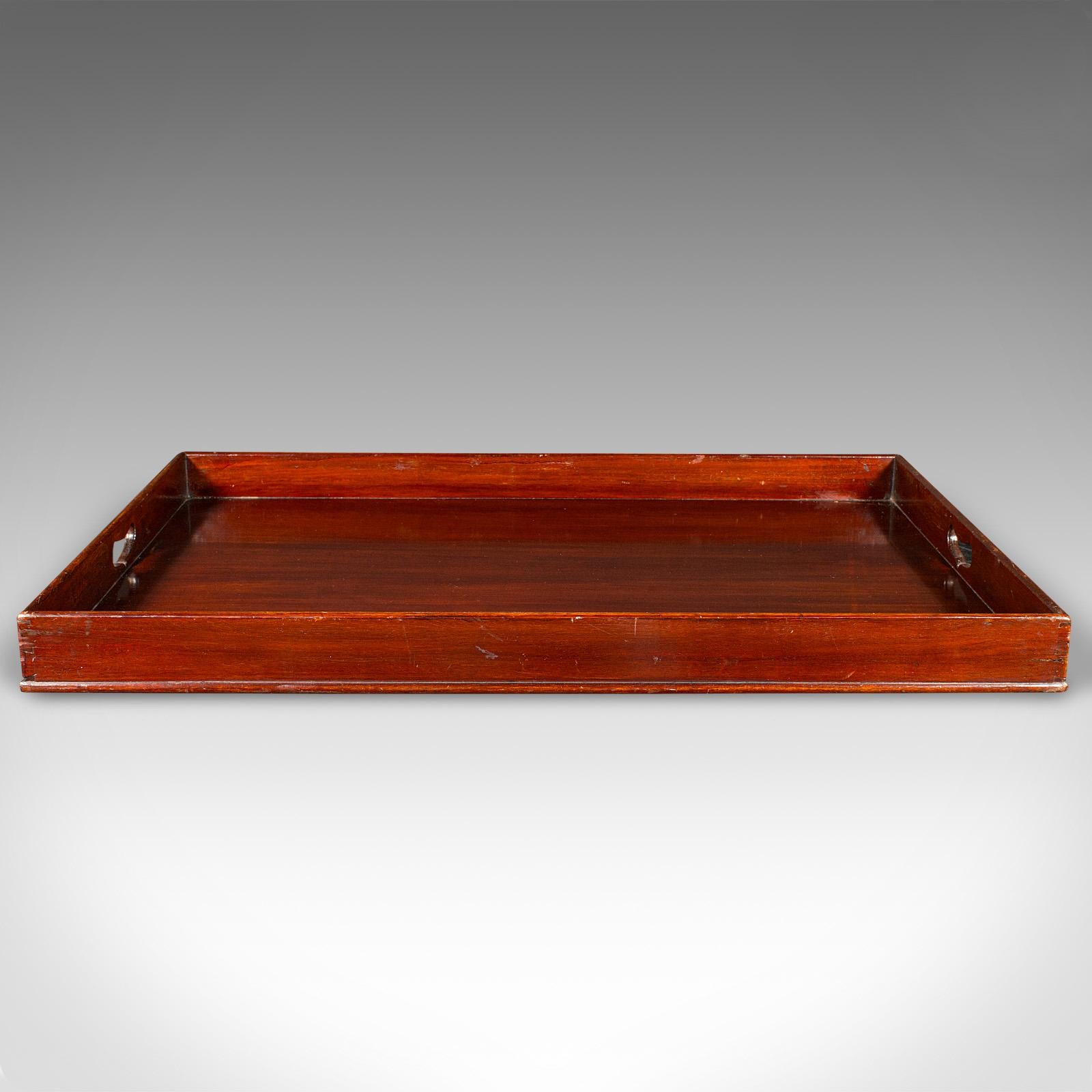 This is a large antique butler's tray. An English, walnut afternoon tea valet, dating to the Georgian period, circa 1800.

Great proportion with superb stocks and rich colour
Displays a desirable aged patina and in good order
Stout walnut stocks
