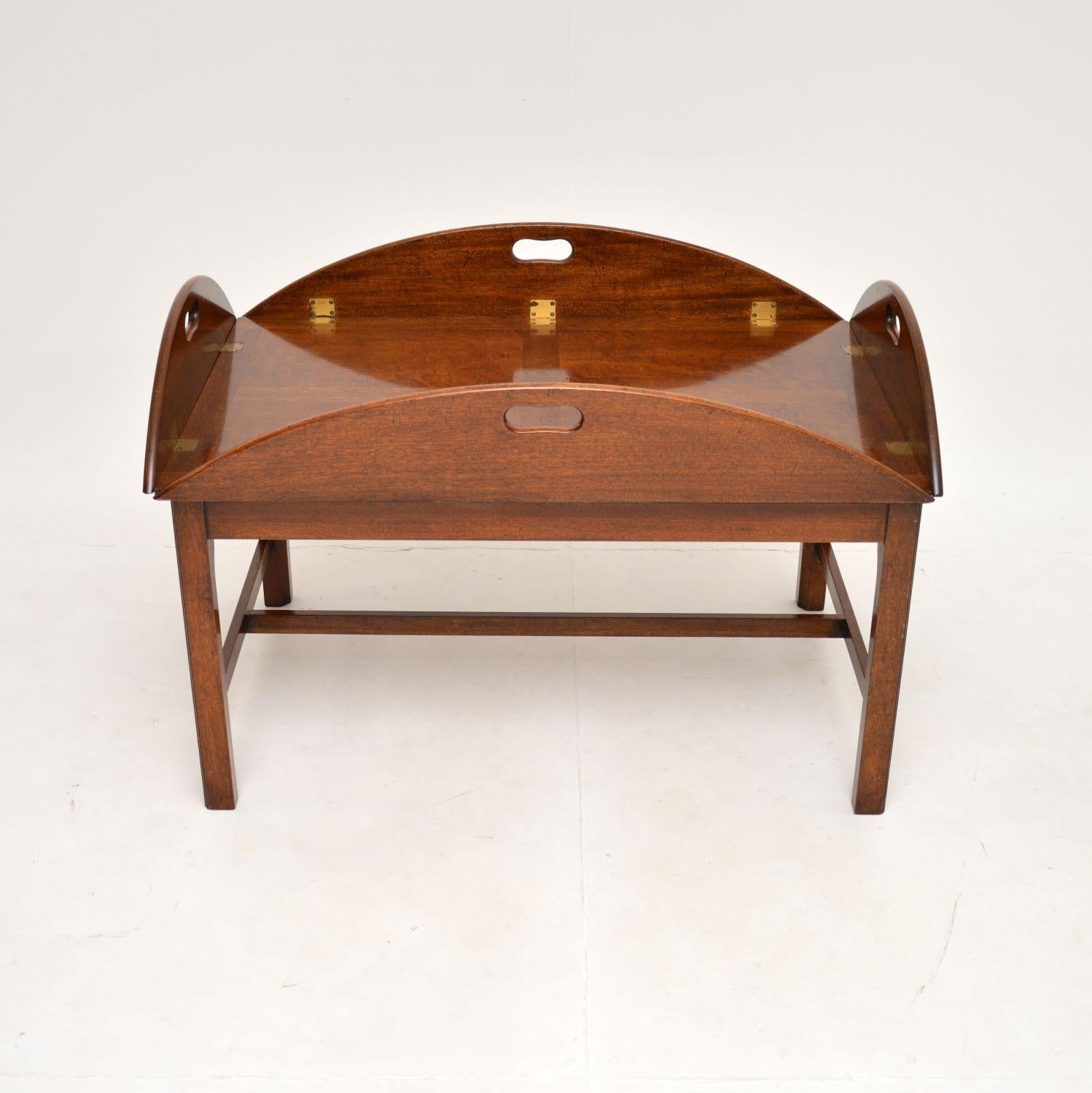 A fantastic large antique butlers tray top coffee table. This was made in England, it dates from around the 1950’s.

It is an impressive size and is of superb quality. The large oval top has edges that fold up, with built in carry handles. It lifts