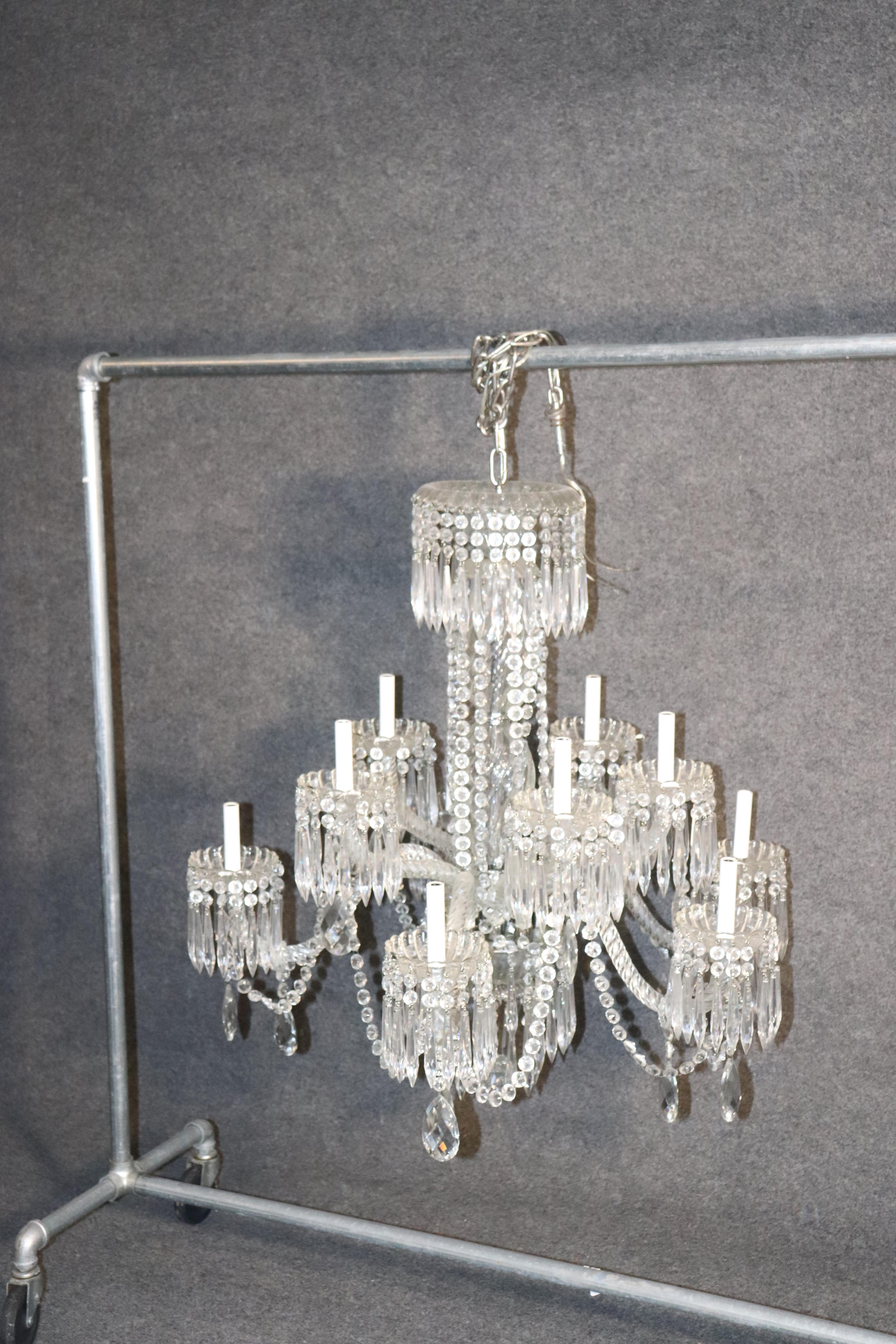 This is a gorgeous and very large antique Waterford cut crystal chandelier of the finest quality and very rare to find in such good condition. The chandelier dates to the 1920s.