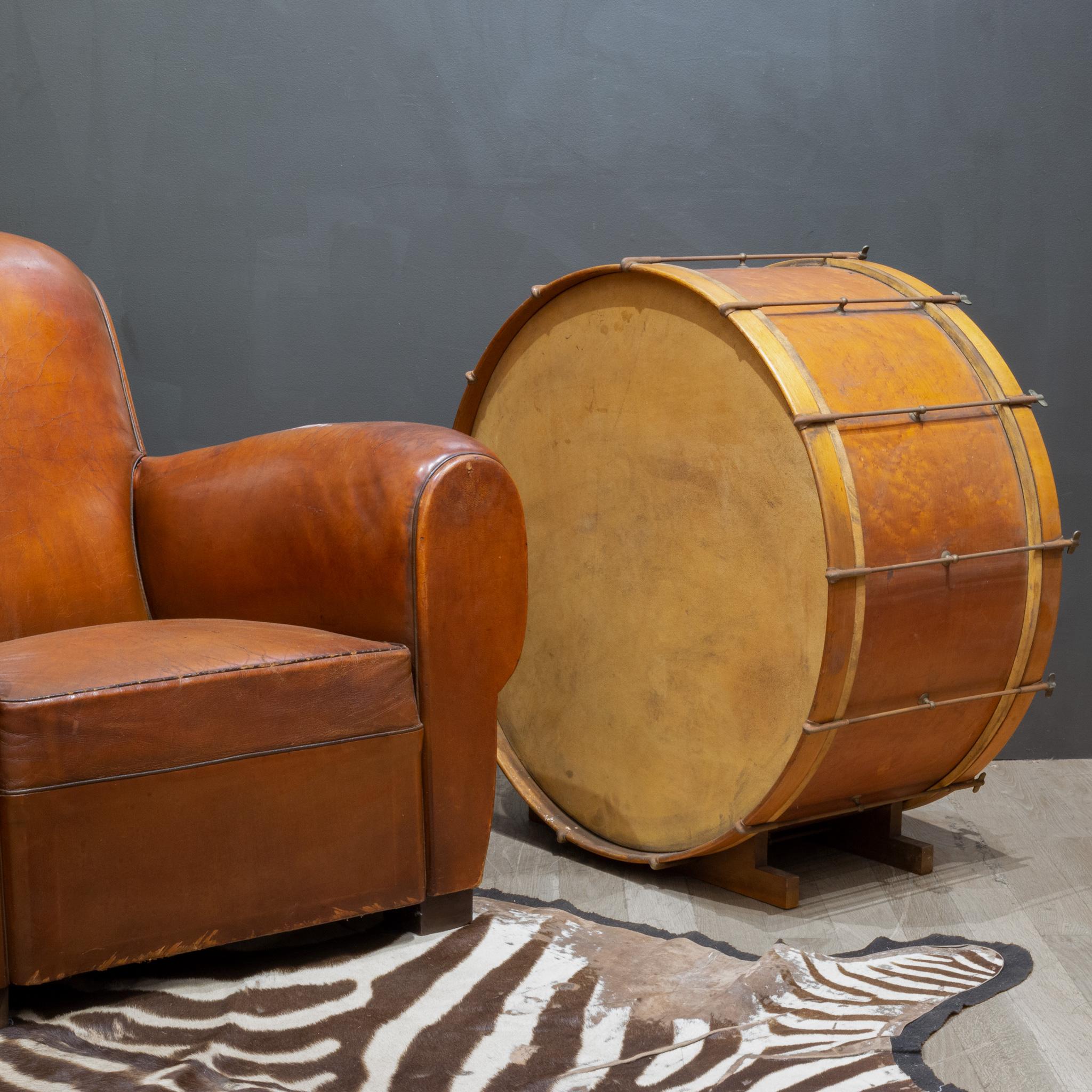 ABOUT

Antique stretched calfskin and wood drum with brass and metal stretchers. The calfskin has no cracks and is intact. The piece has retained its original finish and is in good condition with appropriate patina for its age. A wooden base was