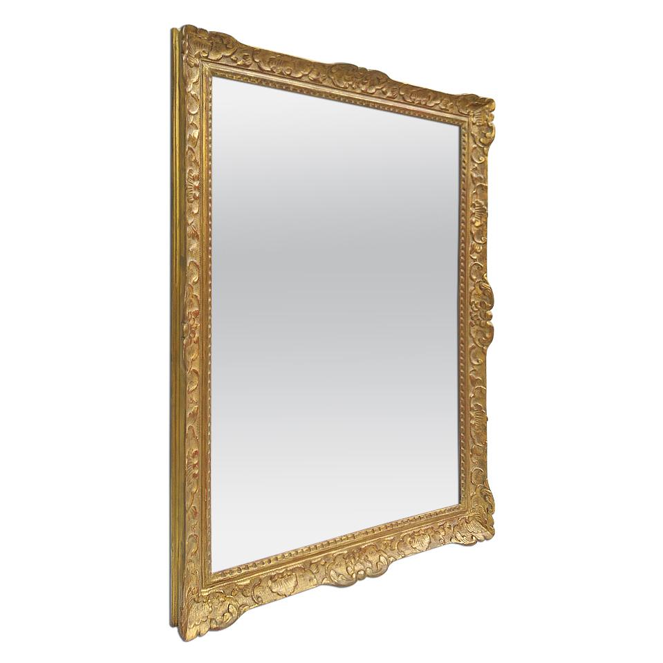 Large antique French mirror of Louis XIV style, circa 1965. Antique carved gilt wood frame (width: 8 cm / 3.14 in.) with French decor Louis XIV style. Gilding to the patinated gold leaf. Modern glass mirror. Antique wood back.