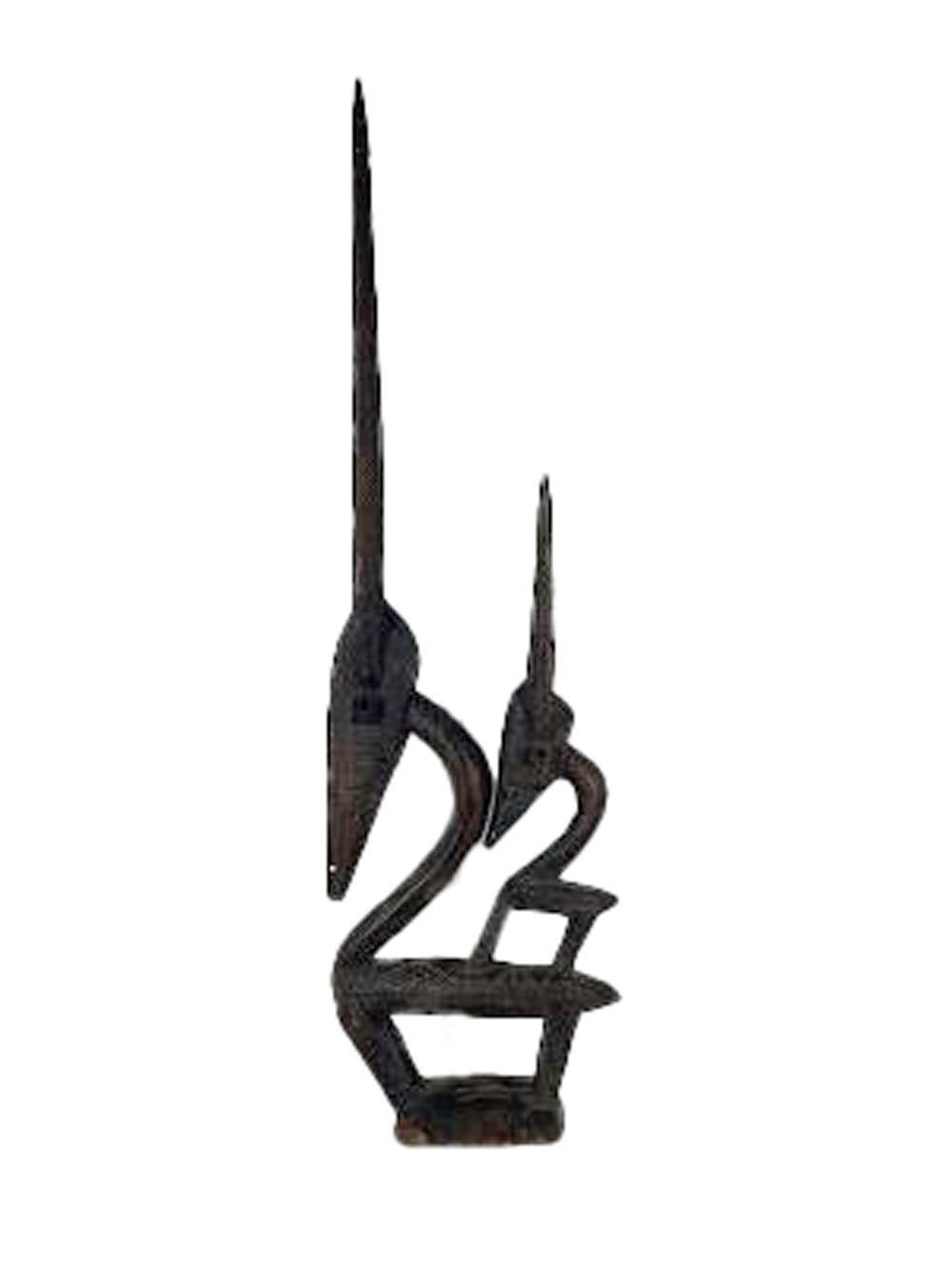 Chi wara is a ritual headdress used by the Bambara people in Mali. Portrayed as both male or female figures Chi ware is associated with agriculture. This female example is a strong and striking figure with a young antelope on its back.
