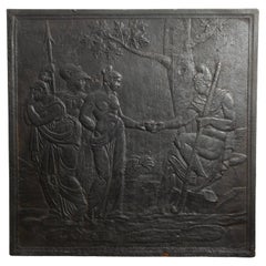 Grande focolare antico in ghisa con scena mitologica