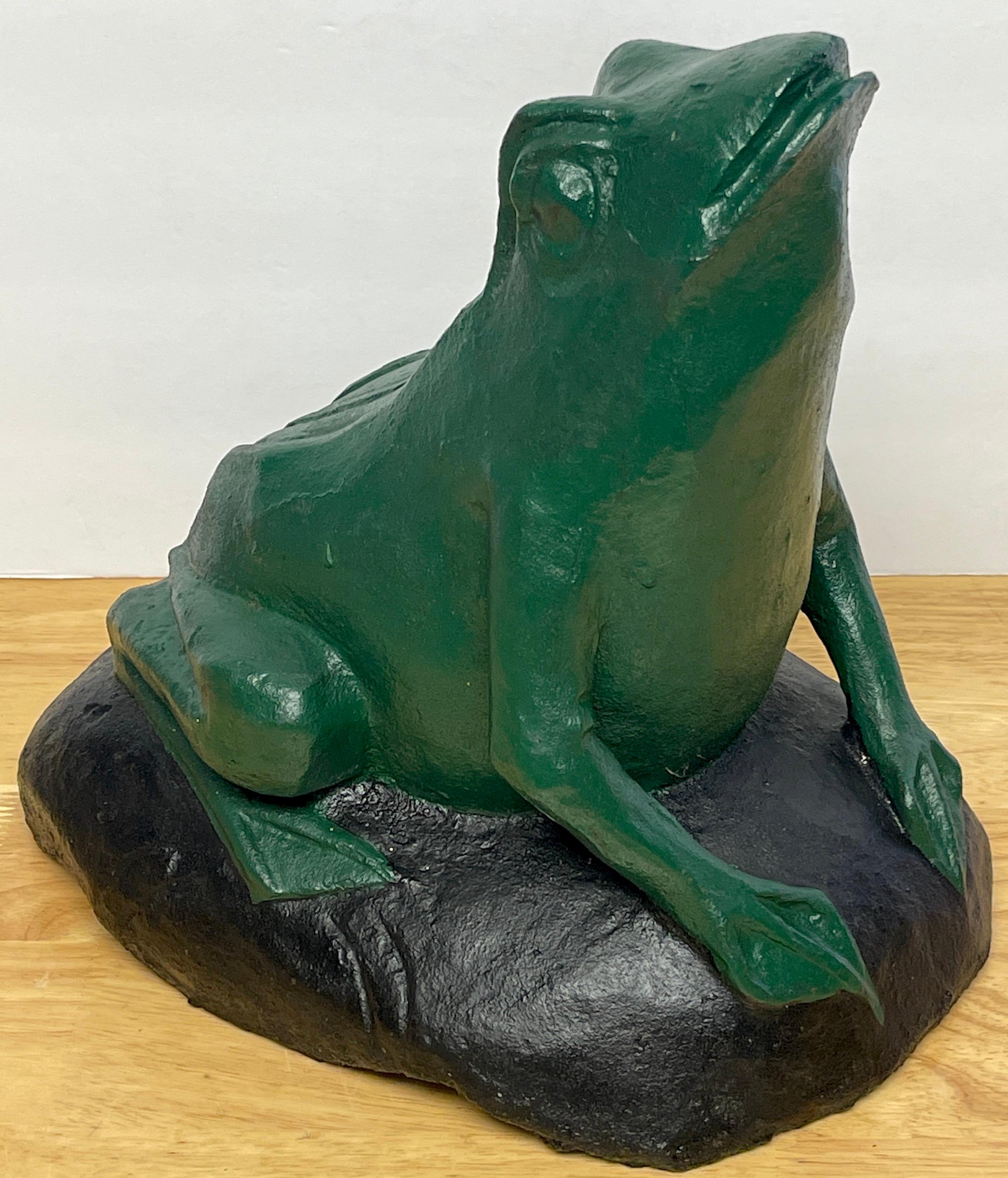 Large Antique cast iron seated frog door stop.
USA, Circa 1920s.

A rare and unusual model, of large size, depicts a seated green frog on a rock facing upwards. Retains original paint. Unmarked.