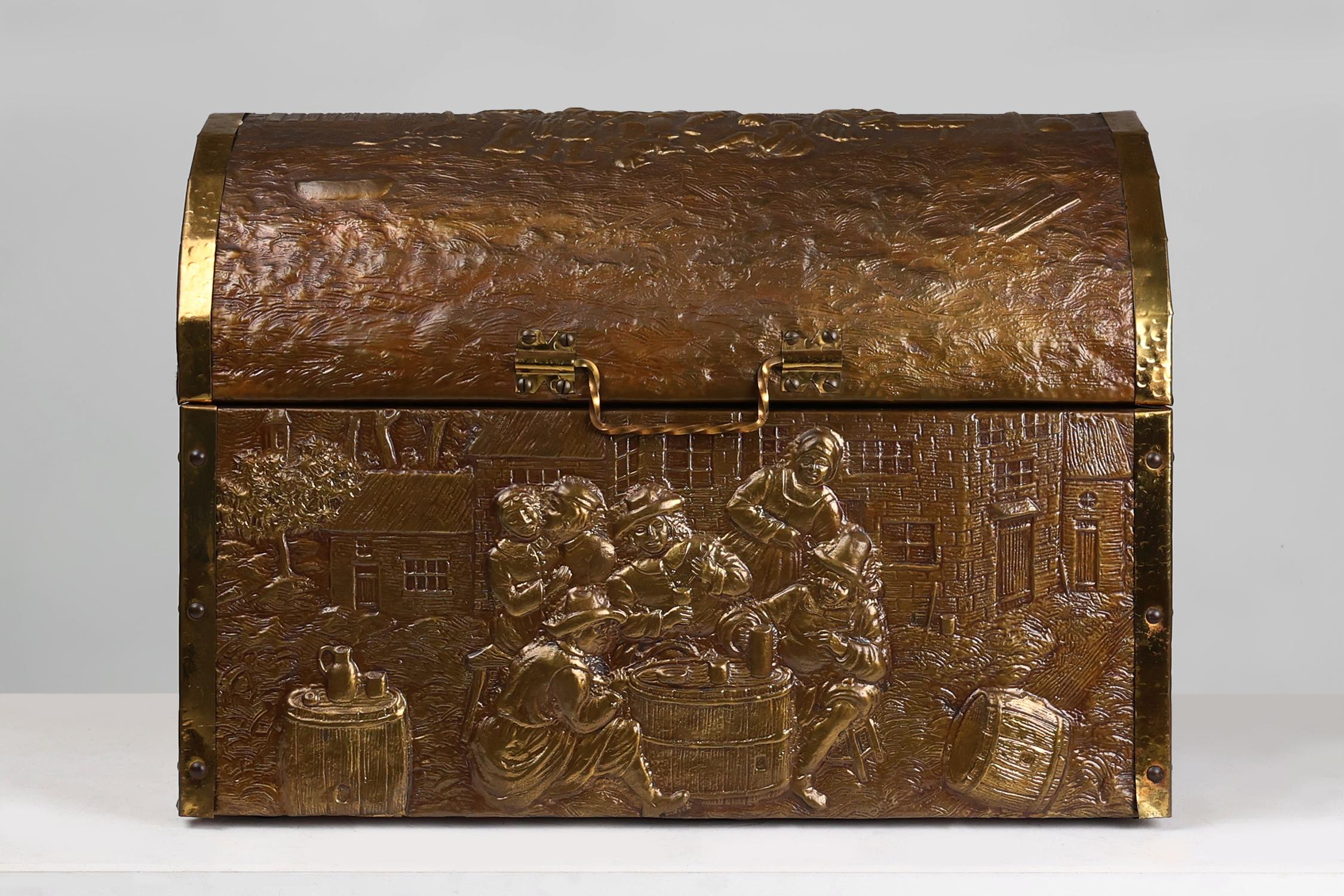 Hammered Large Antique chest covered with sculpted copper relief, Belgium ca. 1930 For Sale