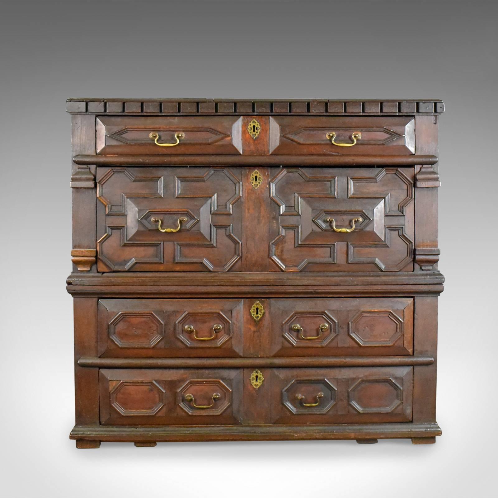 This is a large antique chest of drawers, 17th century, English oak two part chest dating to circa 1700.

Substantial two part chest on block feet
Classic 17th century styling in the geometric decoration
Desirable aged patina to the dark wax